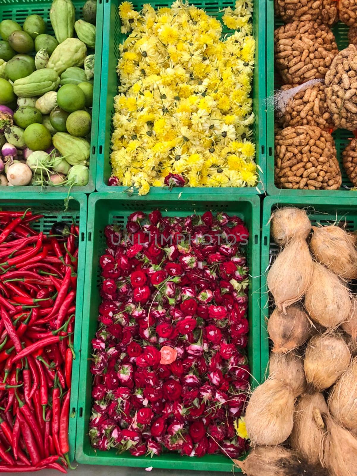 Vegetables and spices are on the market in boxes.