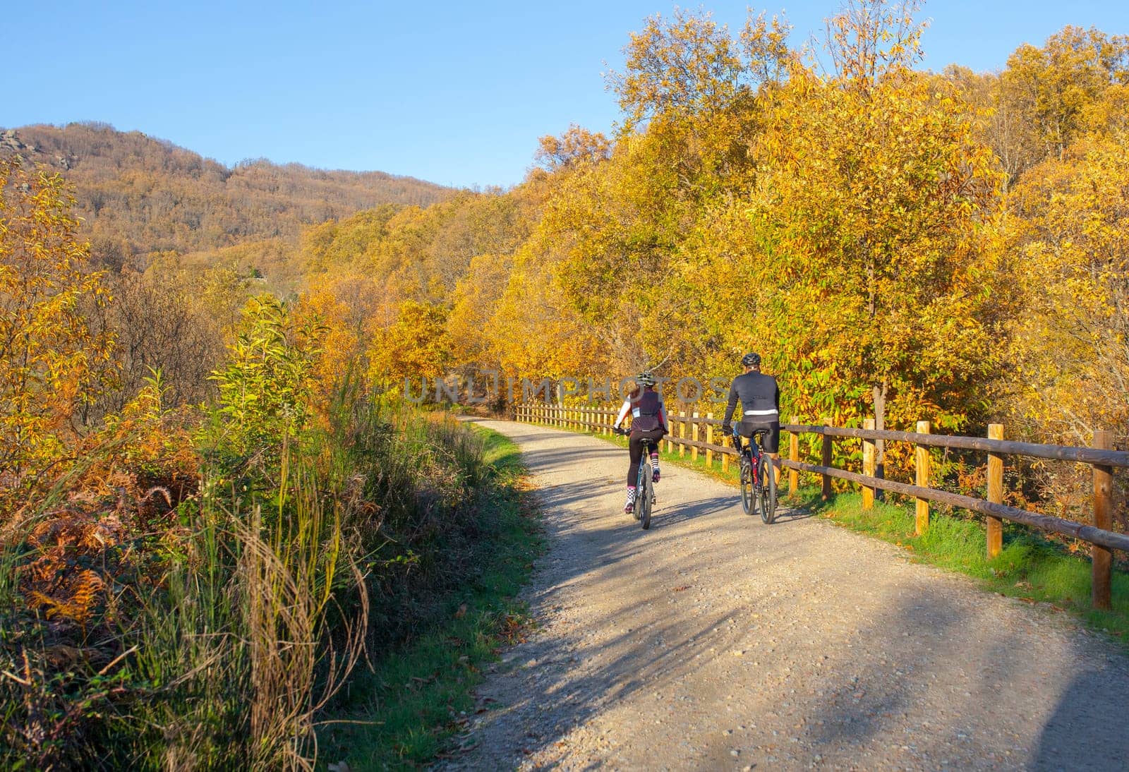 Bikers enjoy Green-Way Itinerary by Banos de Montemayor on Magic Autumn season, Extremadura, Spain
