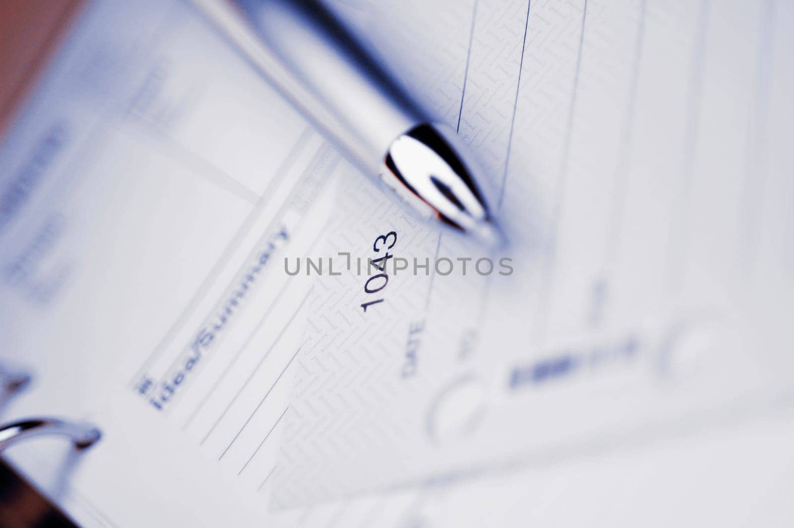 Close_up of a pen on a personal organizer
