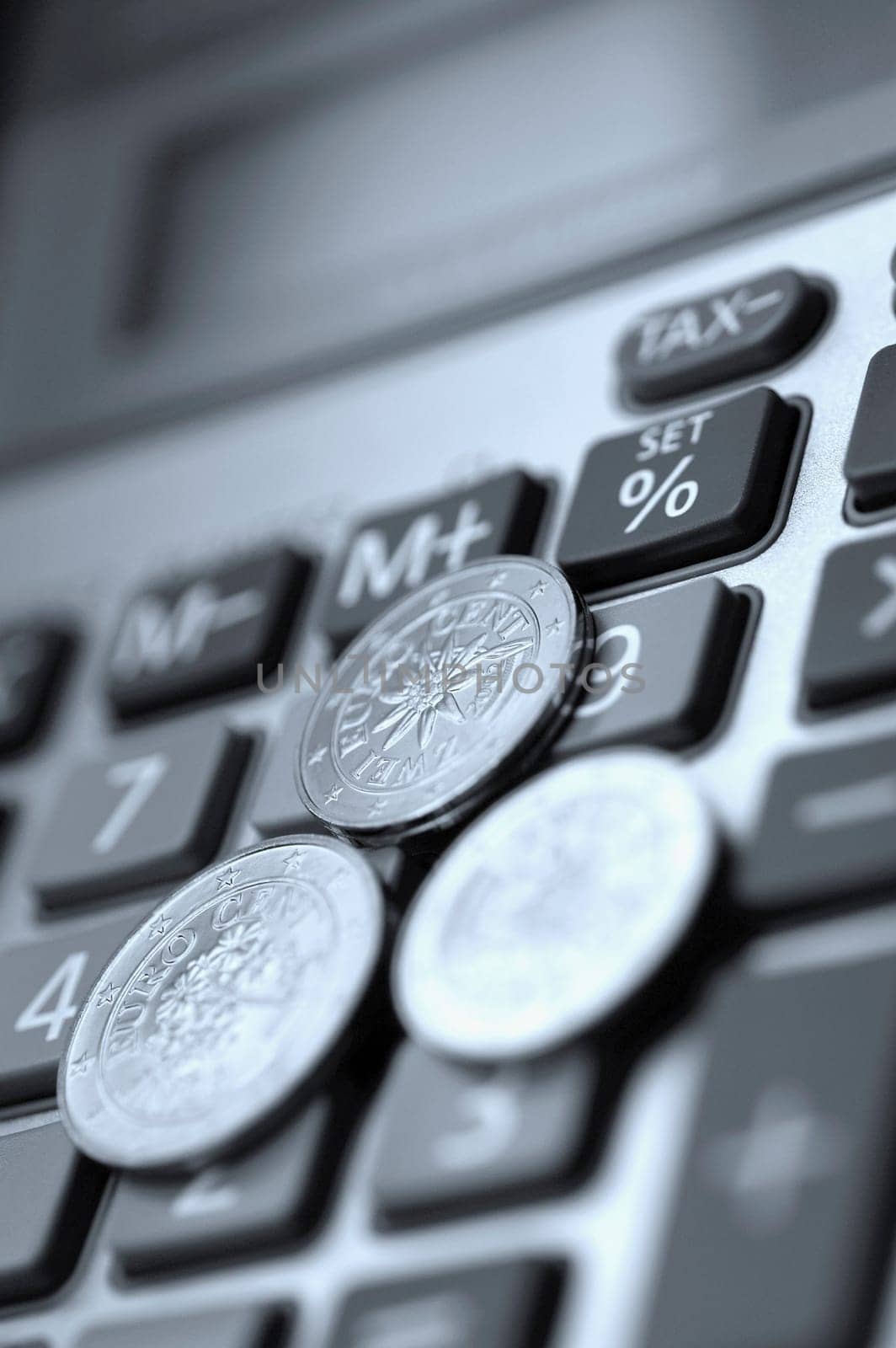 Close_up of European union coins on a calculator