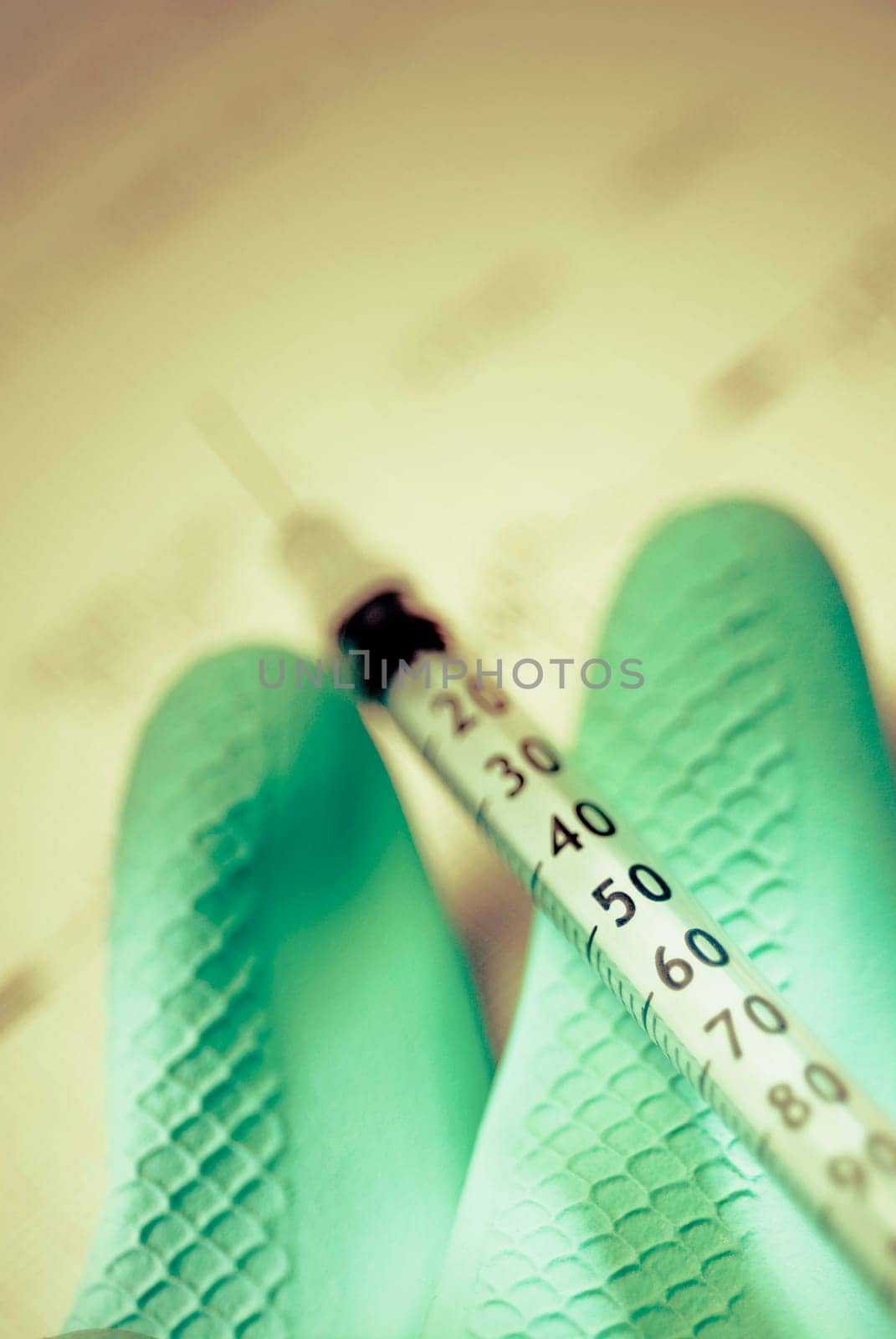 Syringe on a glove