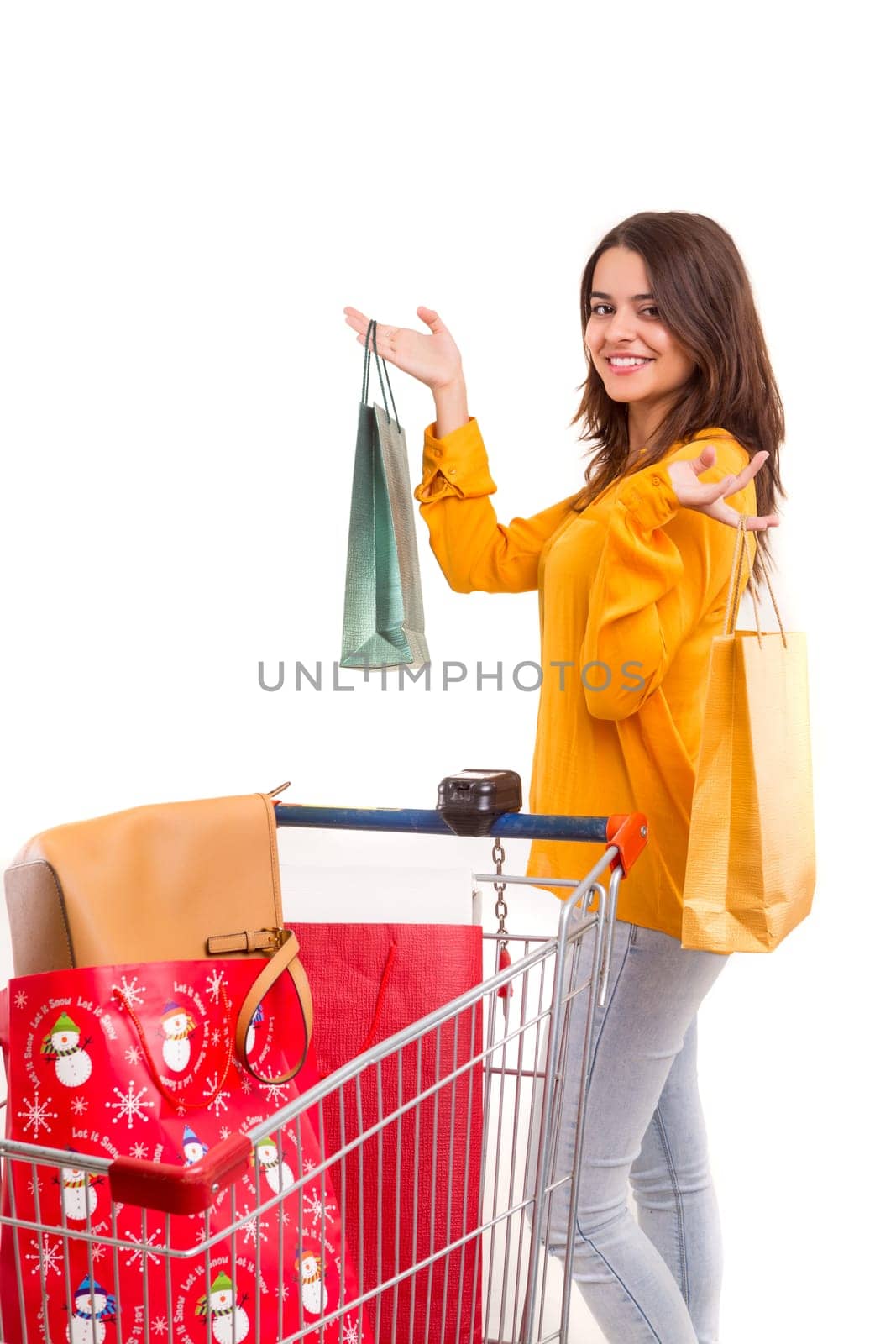 Woman carrying a shopping cart full of gifts