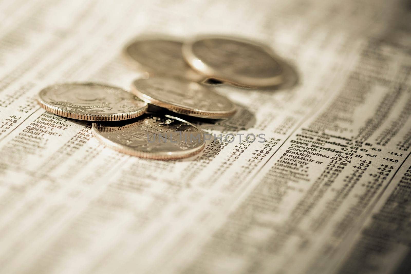 Close_up of coins on a financial newspaper