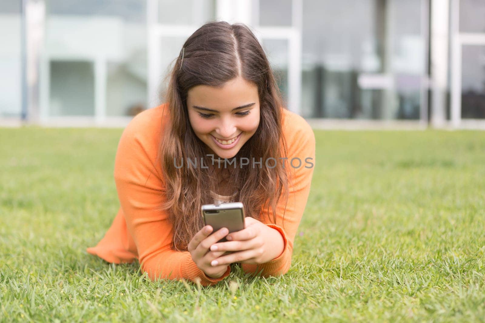 A beautiful young woman relaxing at the city park