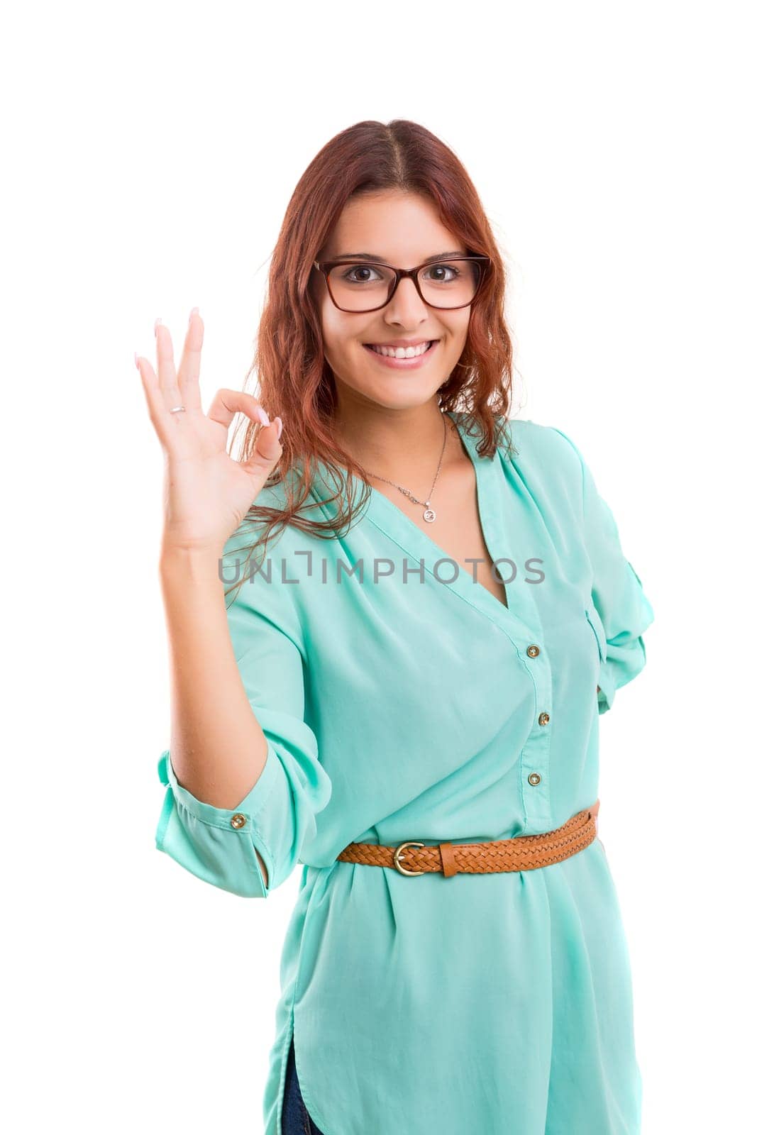 Beautiful young woman signaling ok, isolated over white