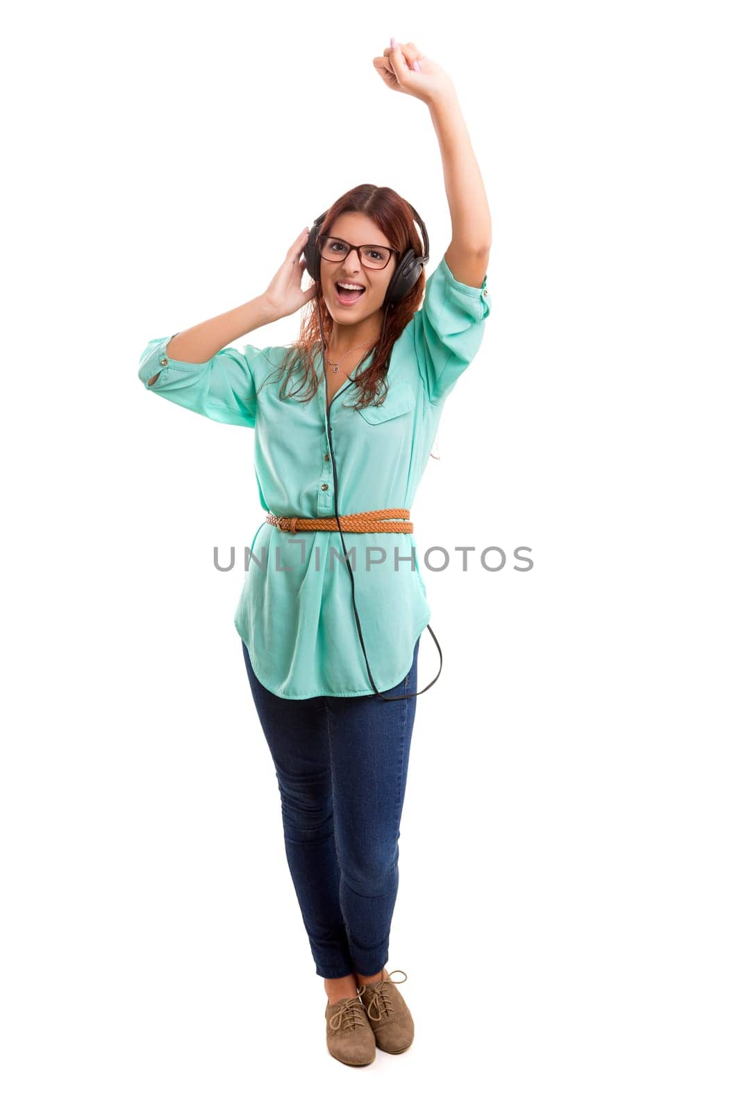 A Happy young woman listening to music