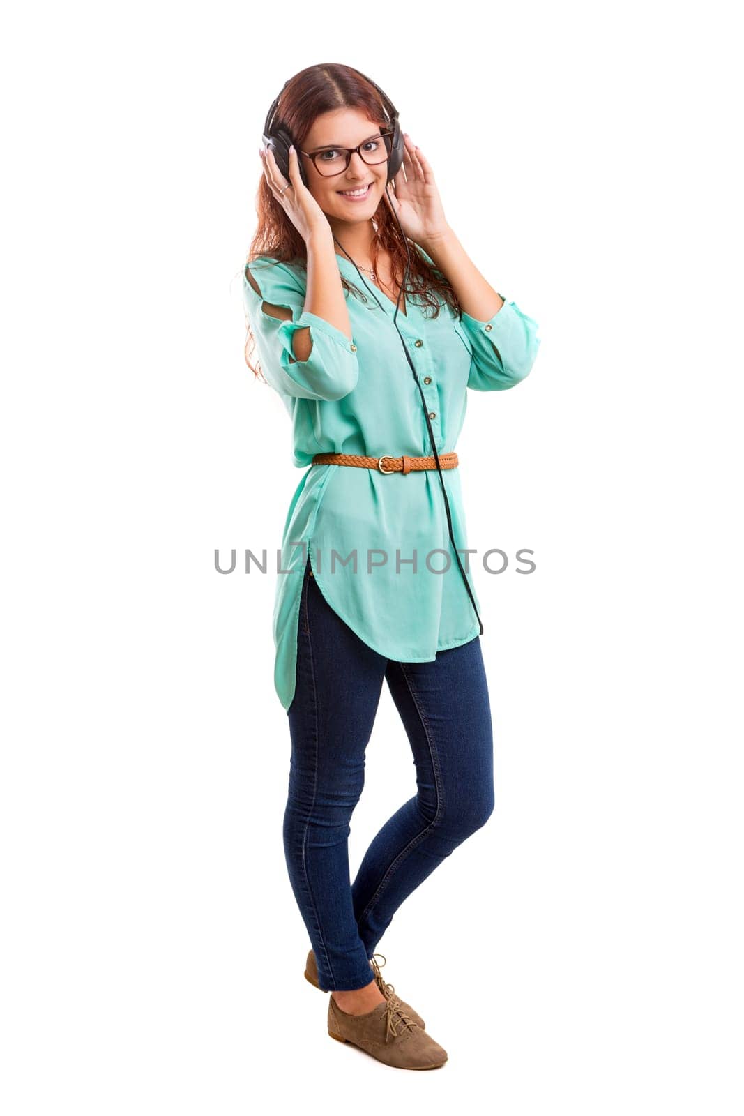 A Happy young woman listening to music