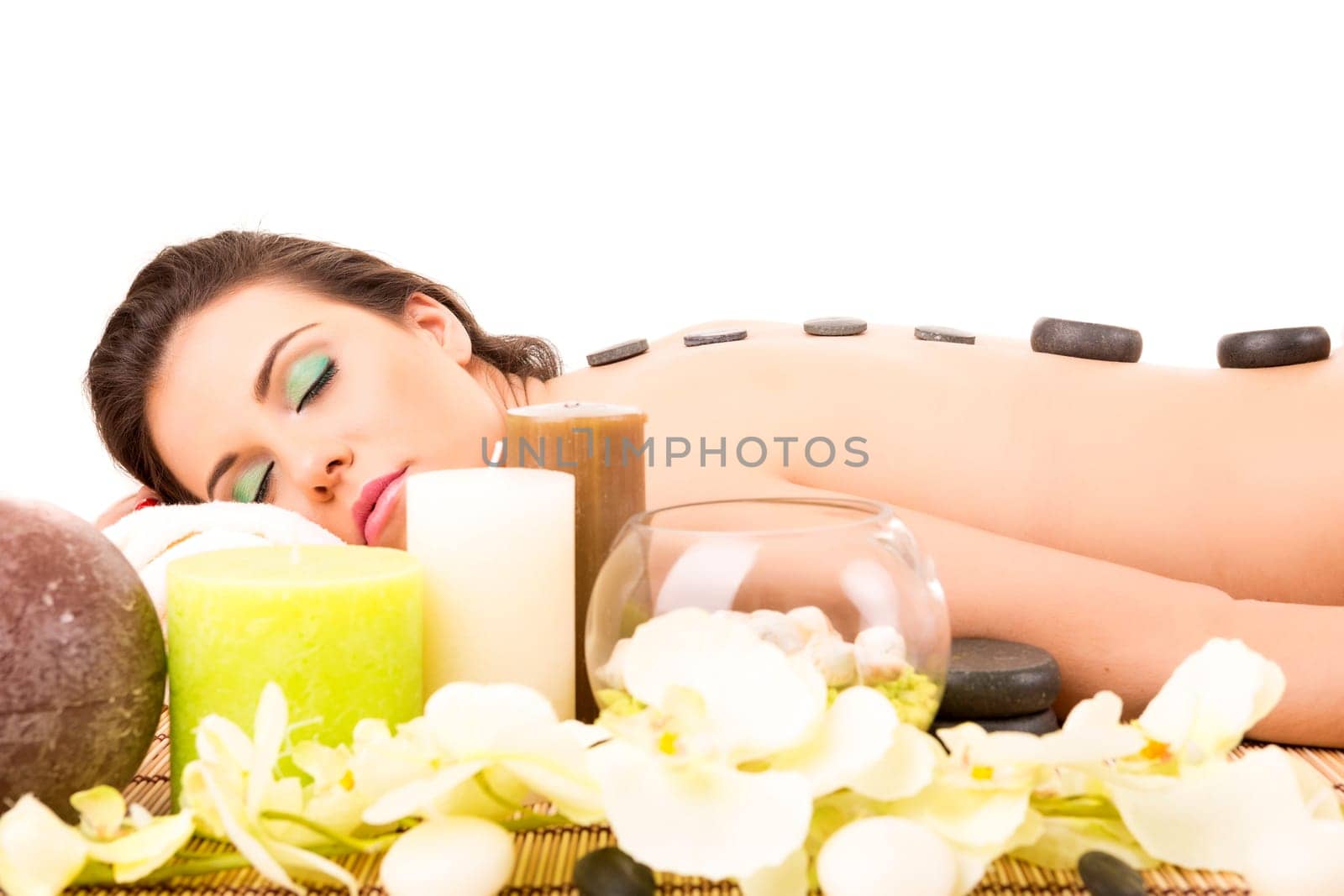 A young beautiful woman relaxing at a spa (wellness concept)