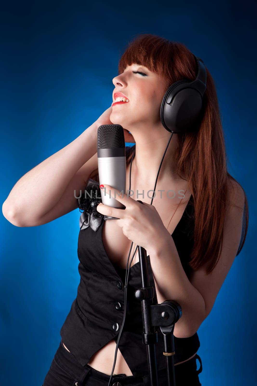 A young and very beautiful woman singing