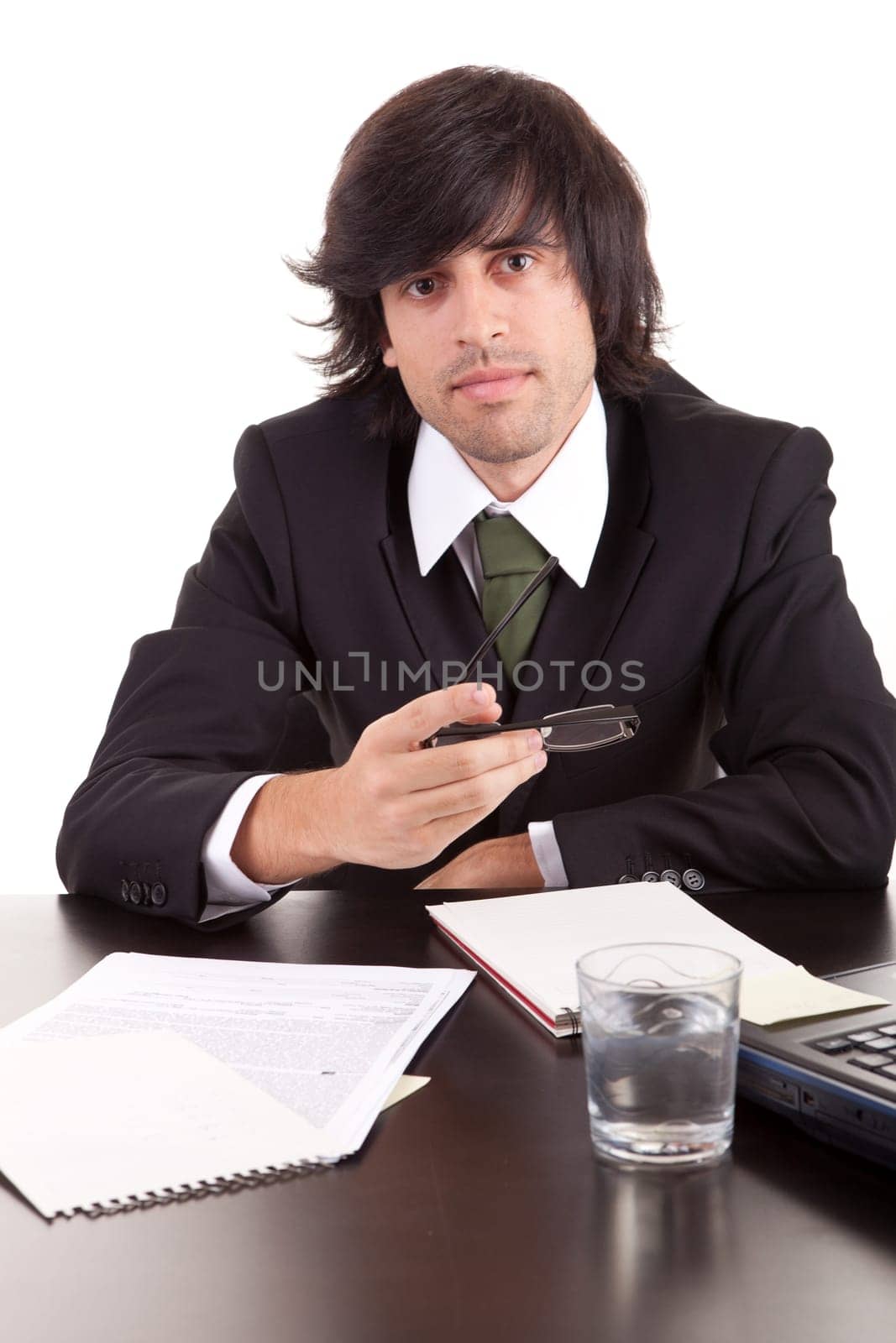 Young business man at work, isolated over white