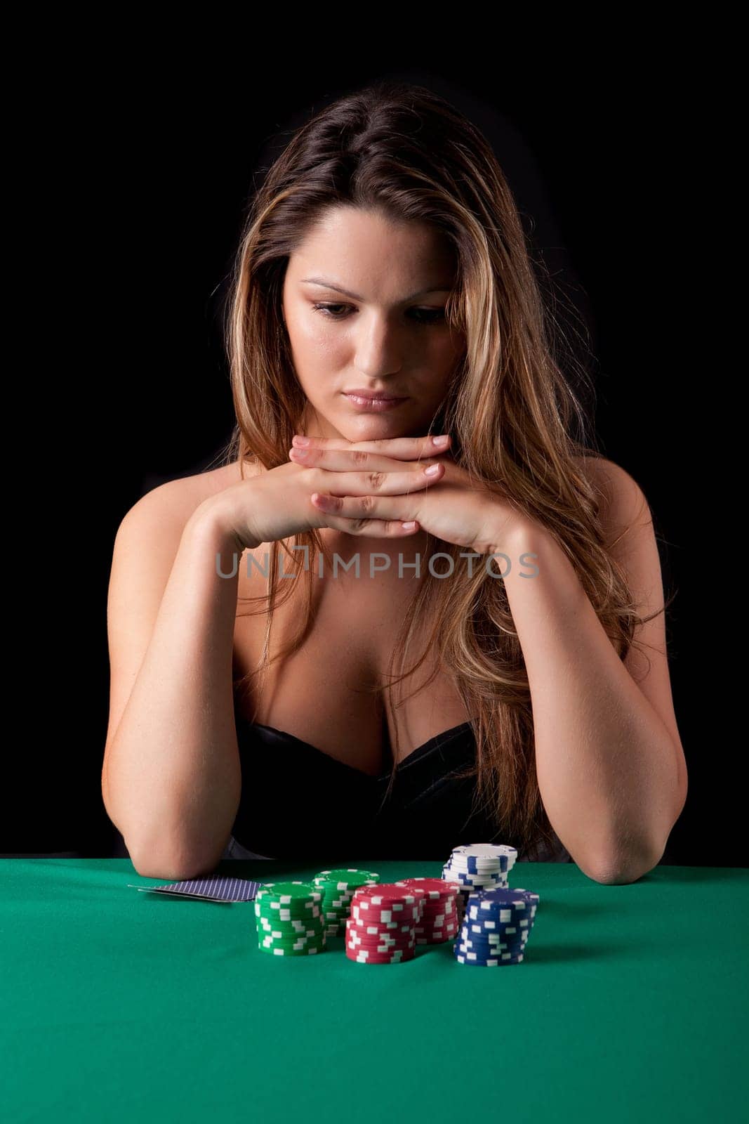 Very beautiful woman playing texas hold'em poker