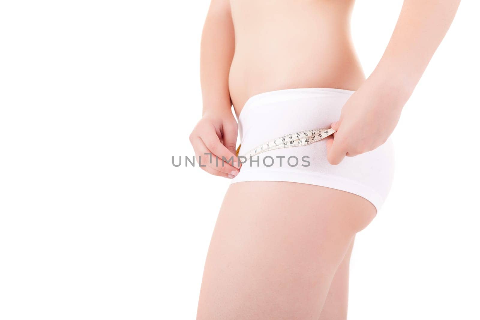 Young woman measuring her body - diet concept