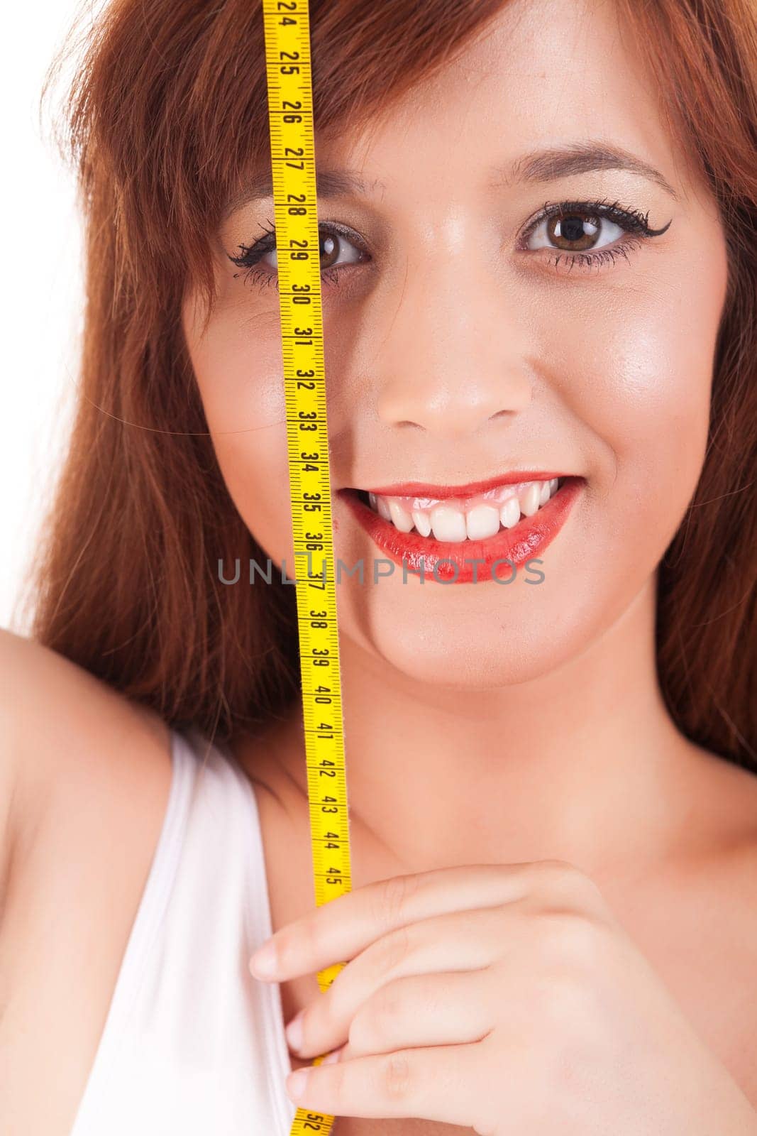 Young woman measuring her body - diet concept