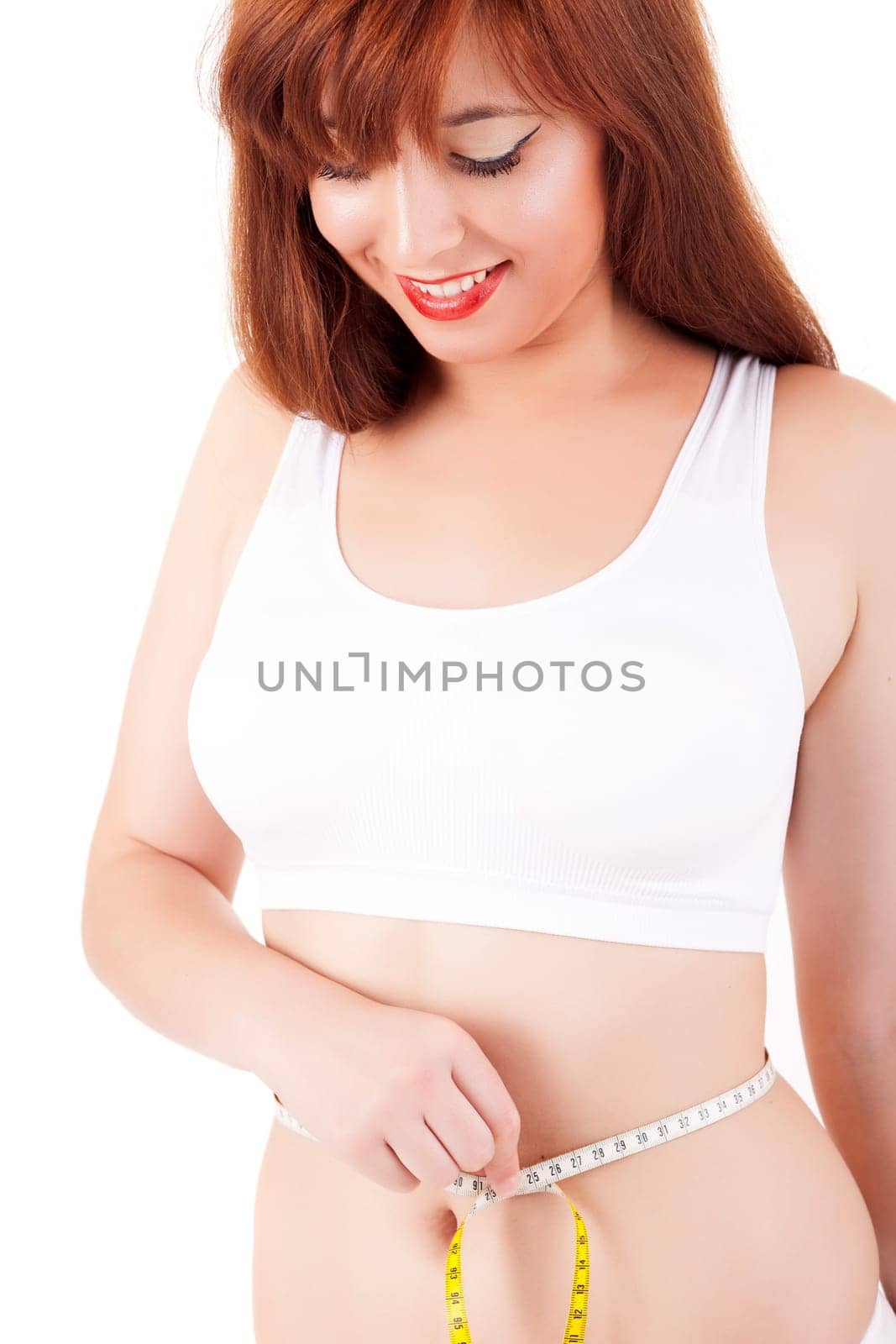 Young woman measuring her body - diet concept