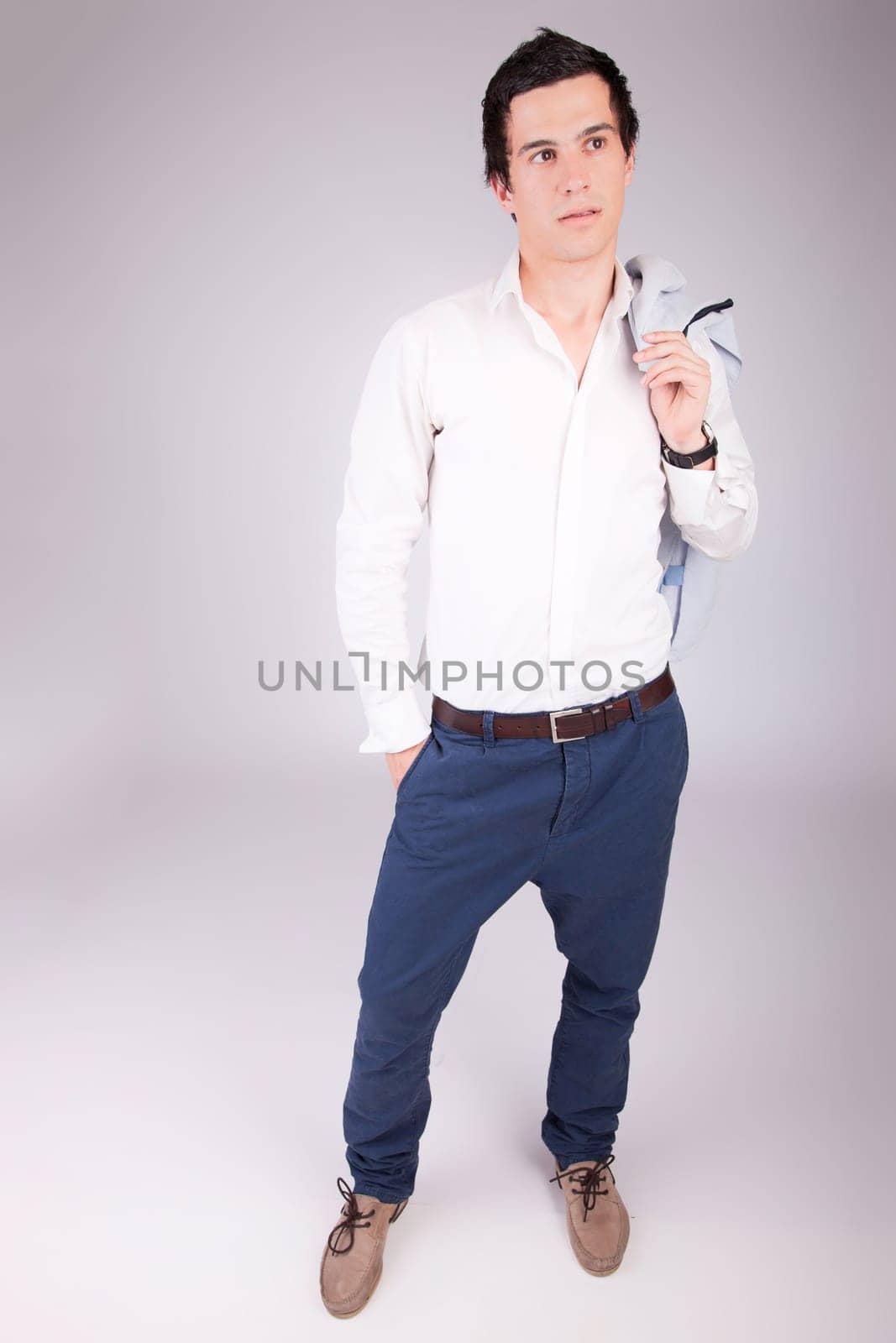 Young casual boy posing isolated
