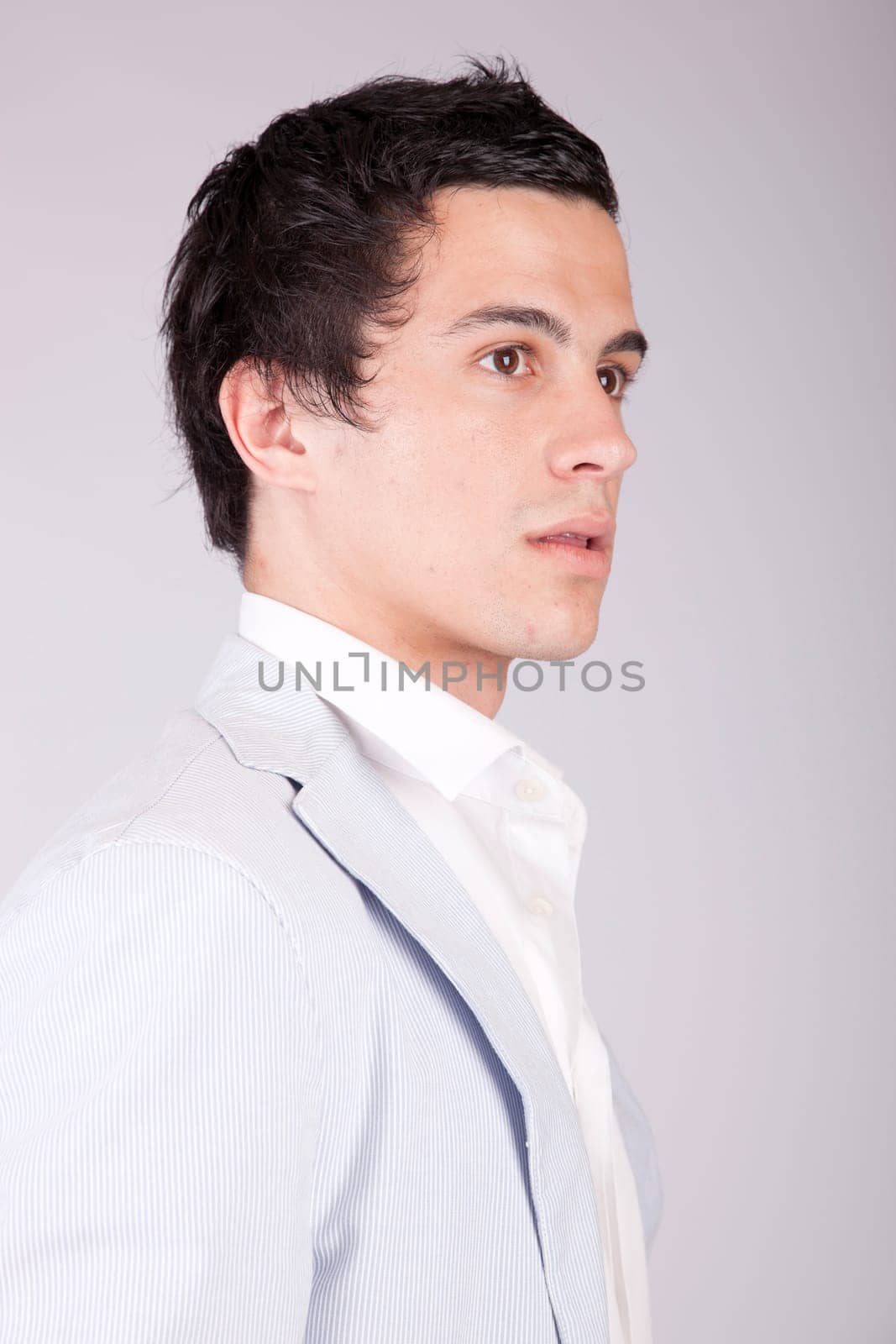 Young casual boy posing isolated