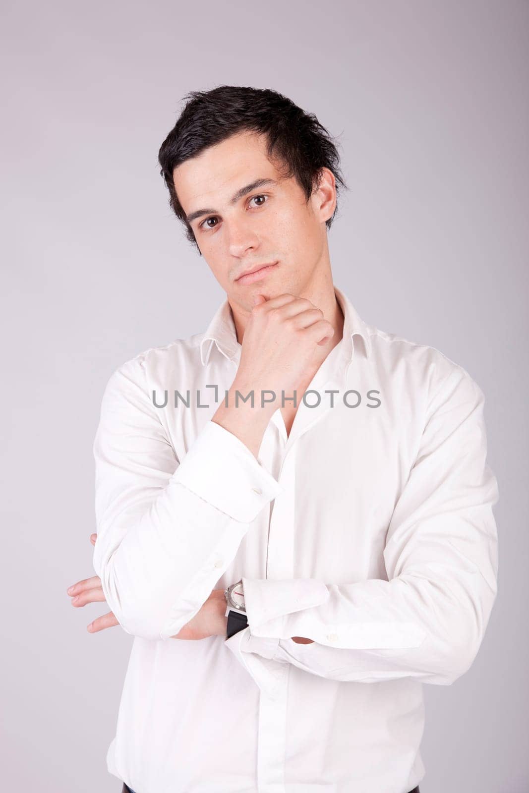 Young casual boy posing isolated