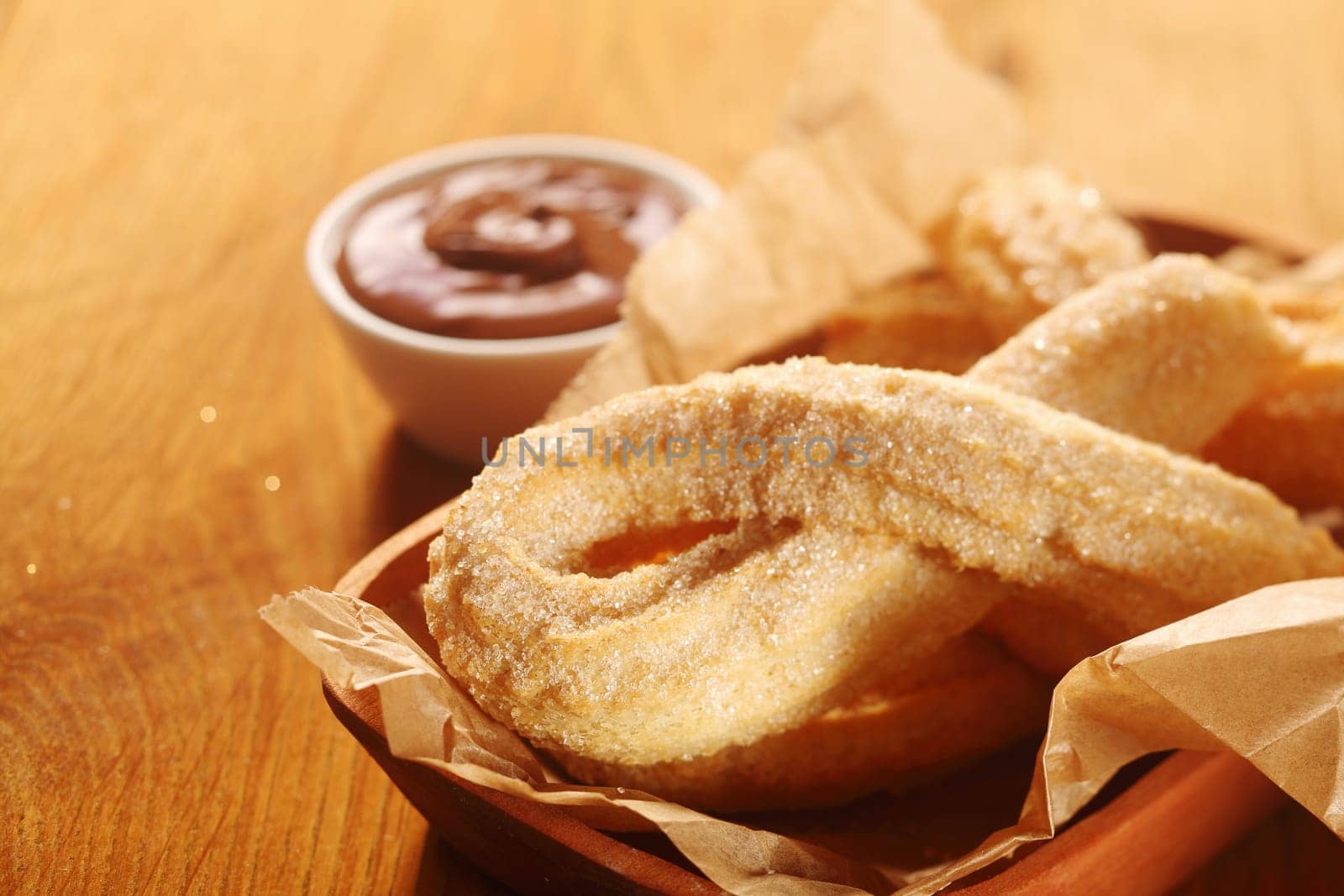 Close up Mouth Watering Churros Snacks on Tray with Chocolate Dipping Sauce.