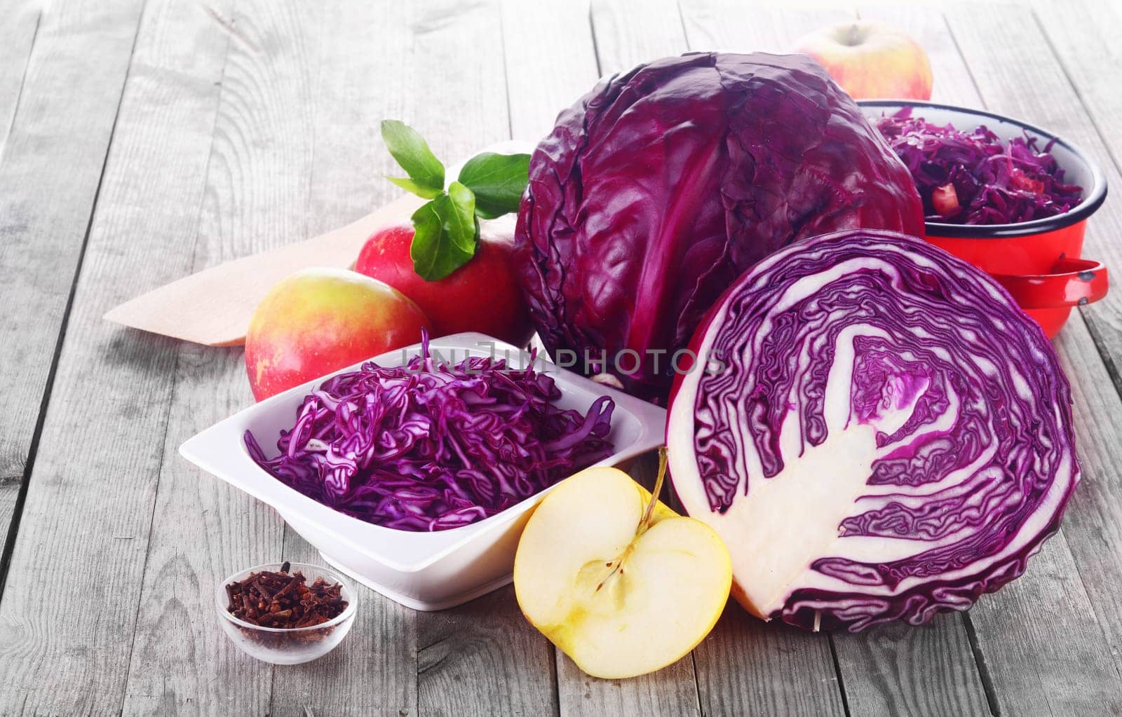 Healthy Food Concept - Close up Fresh Apples and Red Cabbage for Salad on Top of Wooden table