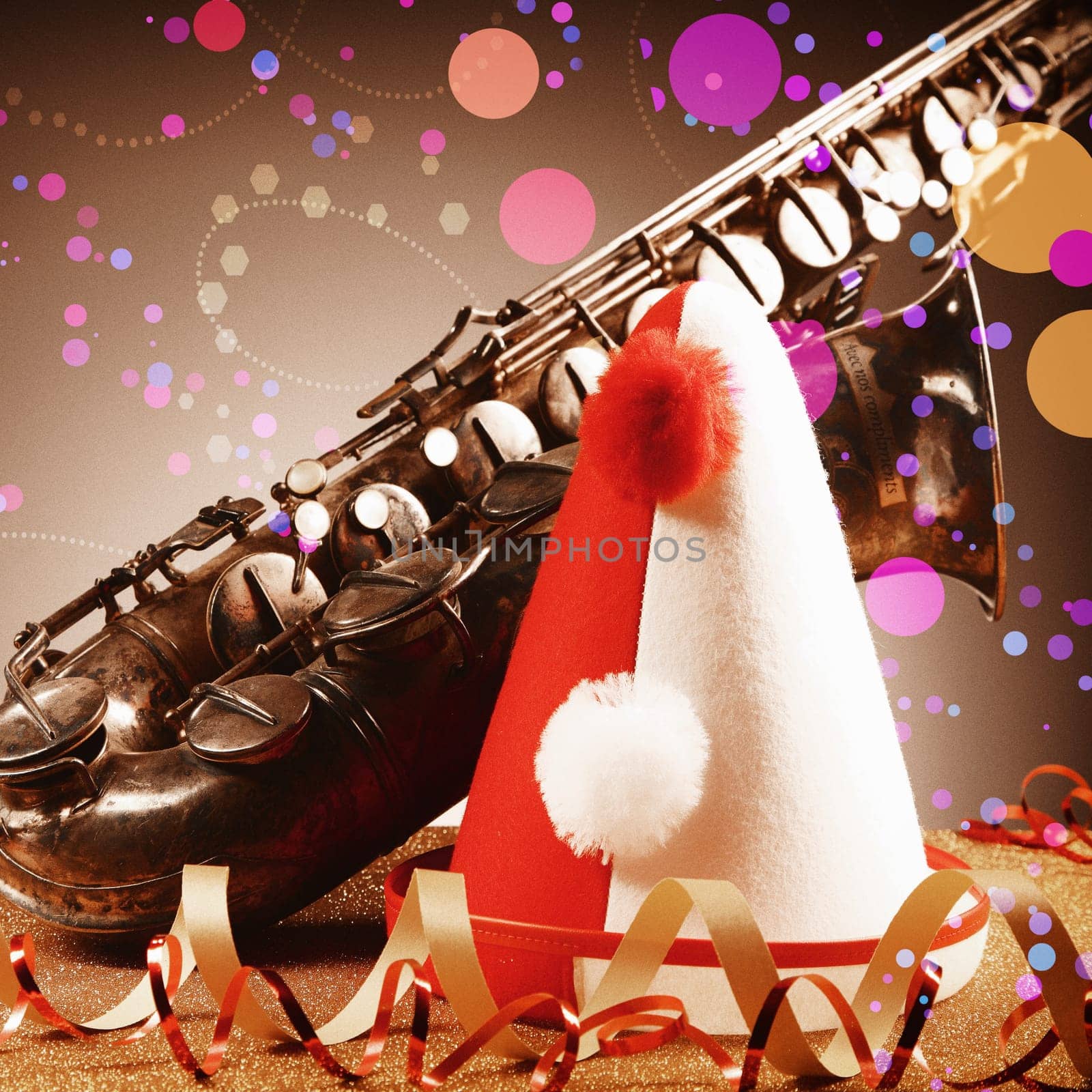 Festival Concept - Close up Red White Party Hat, Paper Streamers and Vintage Saxophone Instrument with Abstract Effects on Gradient Brown Background.