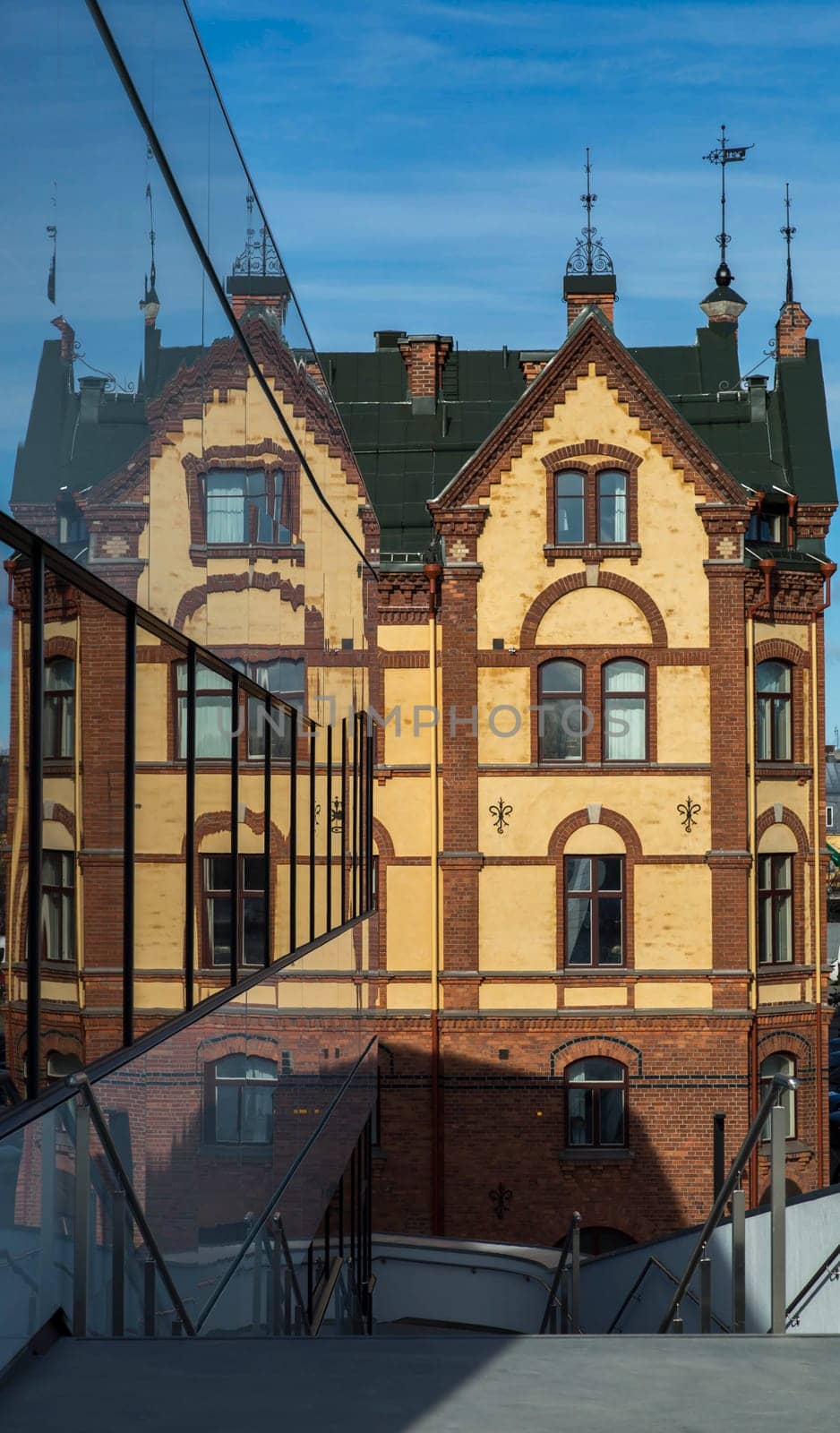 Old Building Reflected in Modern Windows in Umeå, Sweden