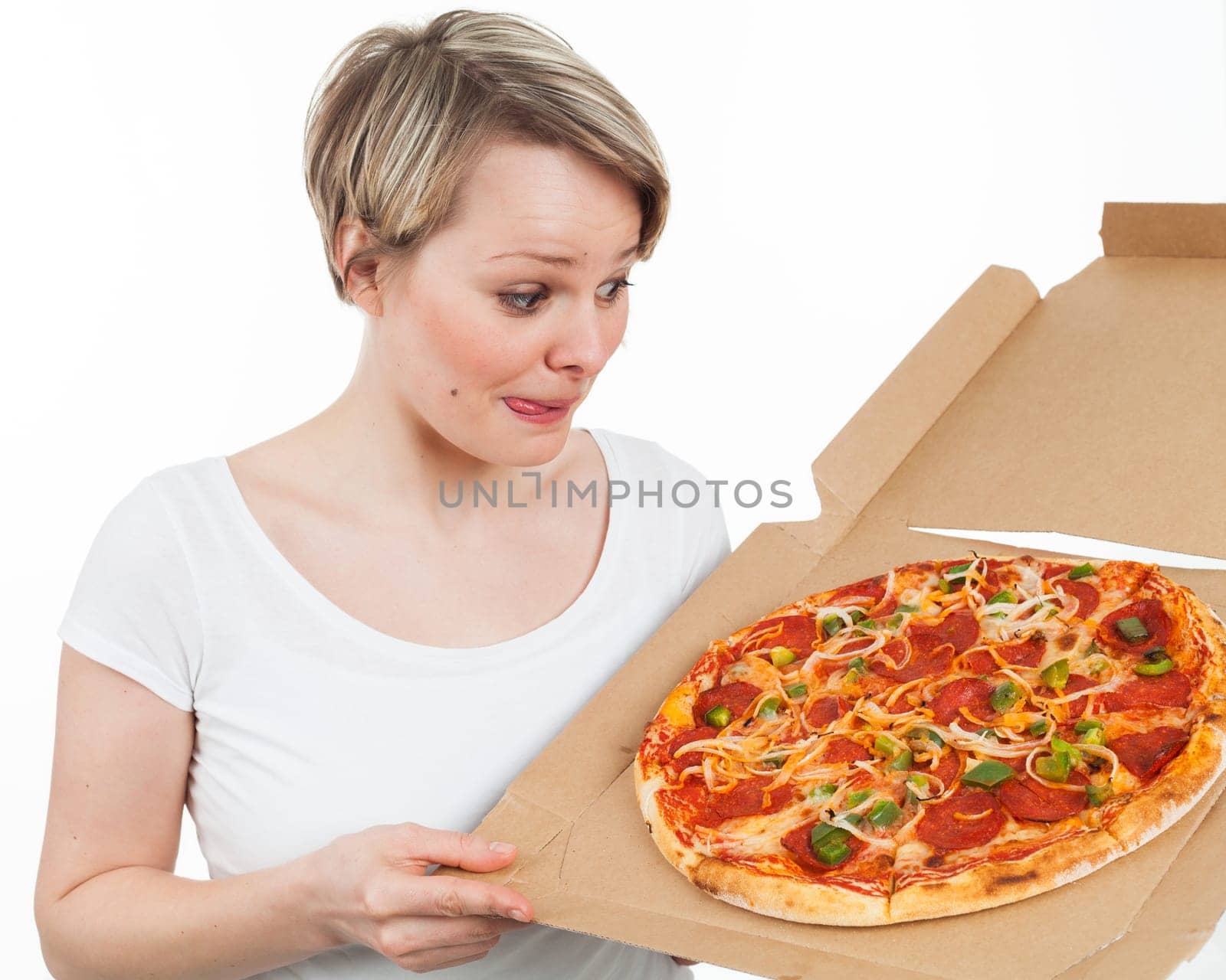 Young woman looking at a pizza and drooling over, isolated on white