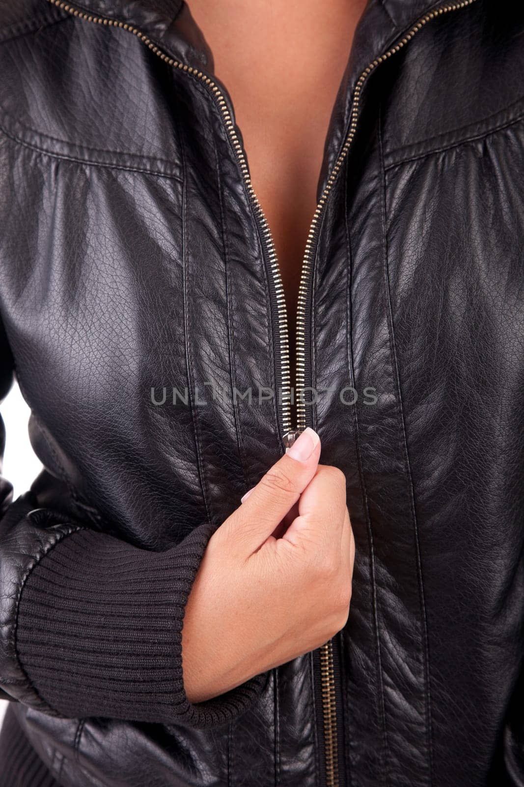 Detail of woman unzipping black coat