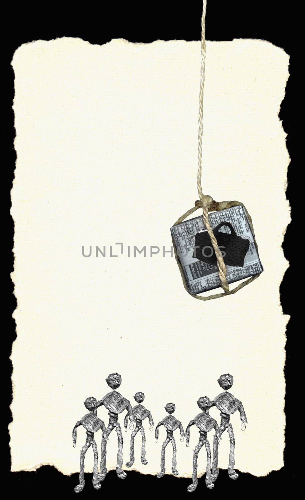 Box wrapped in newspaper dangling from a rope