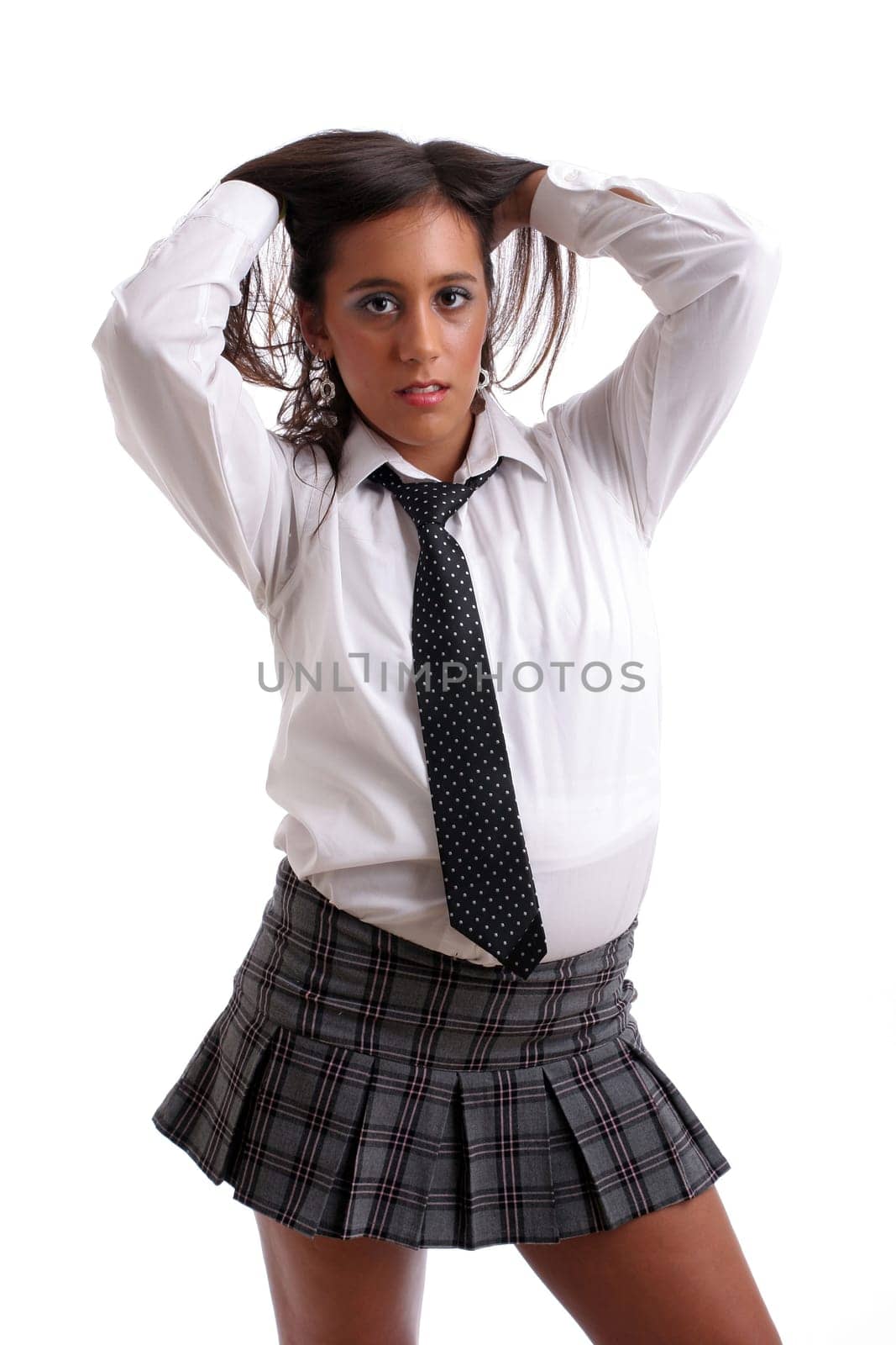 Hot schoolgirl posing isolated over white background
