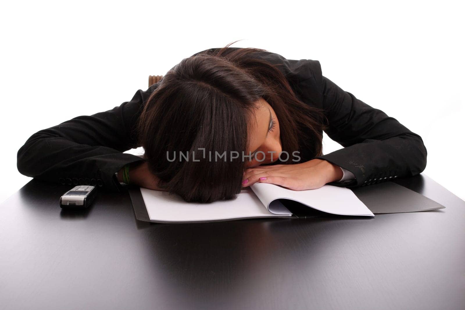 young business woman sleeping on the desk, isolated in white background