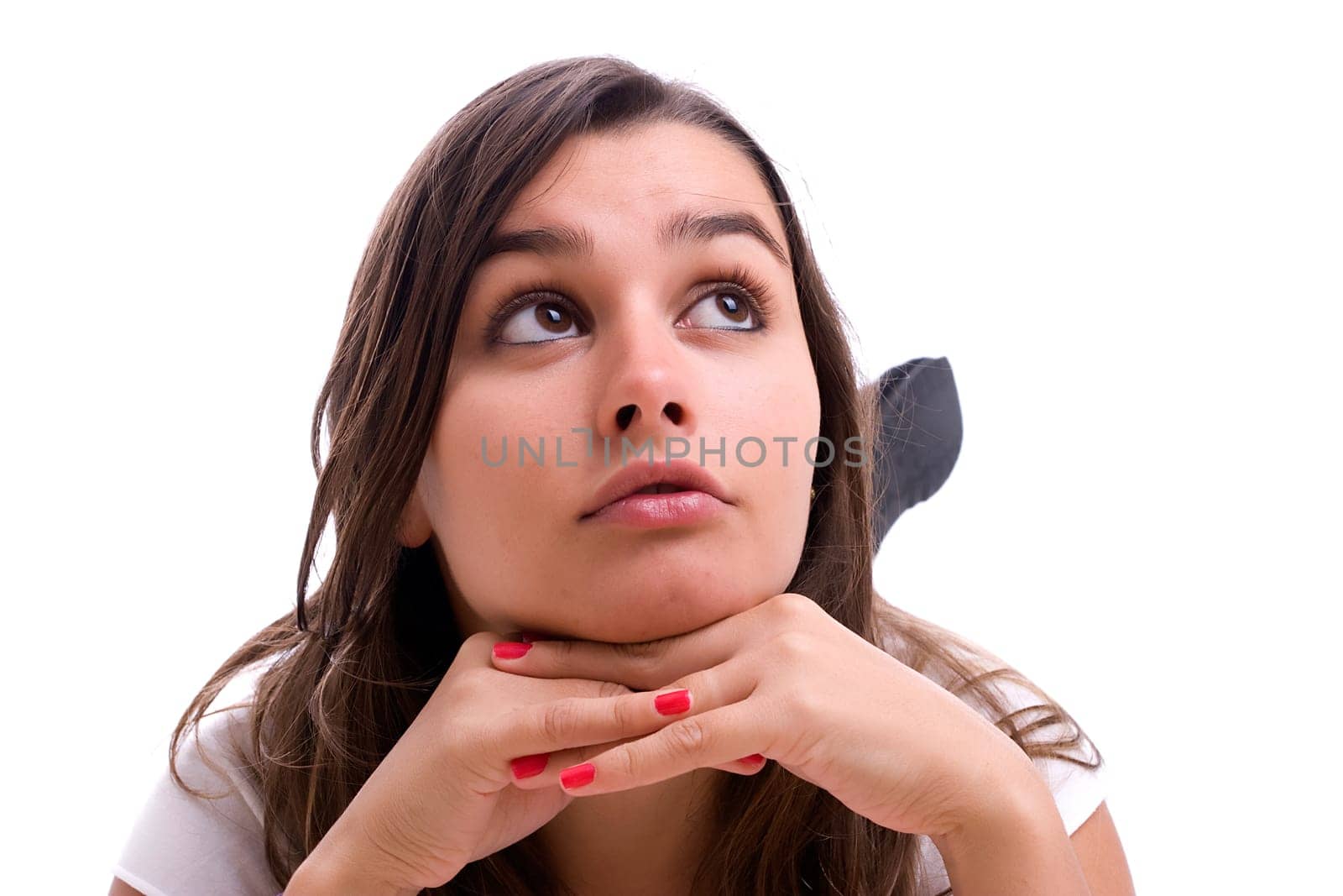 Young sad girl portrait, isolated over black