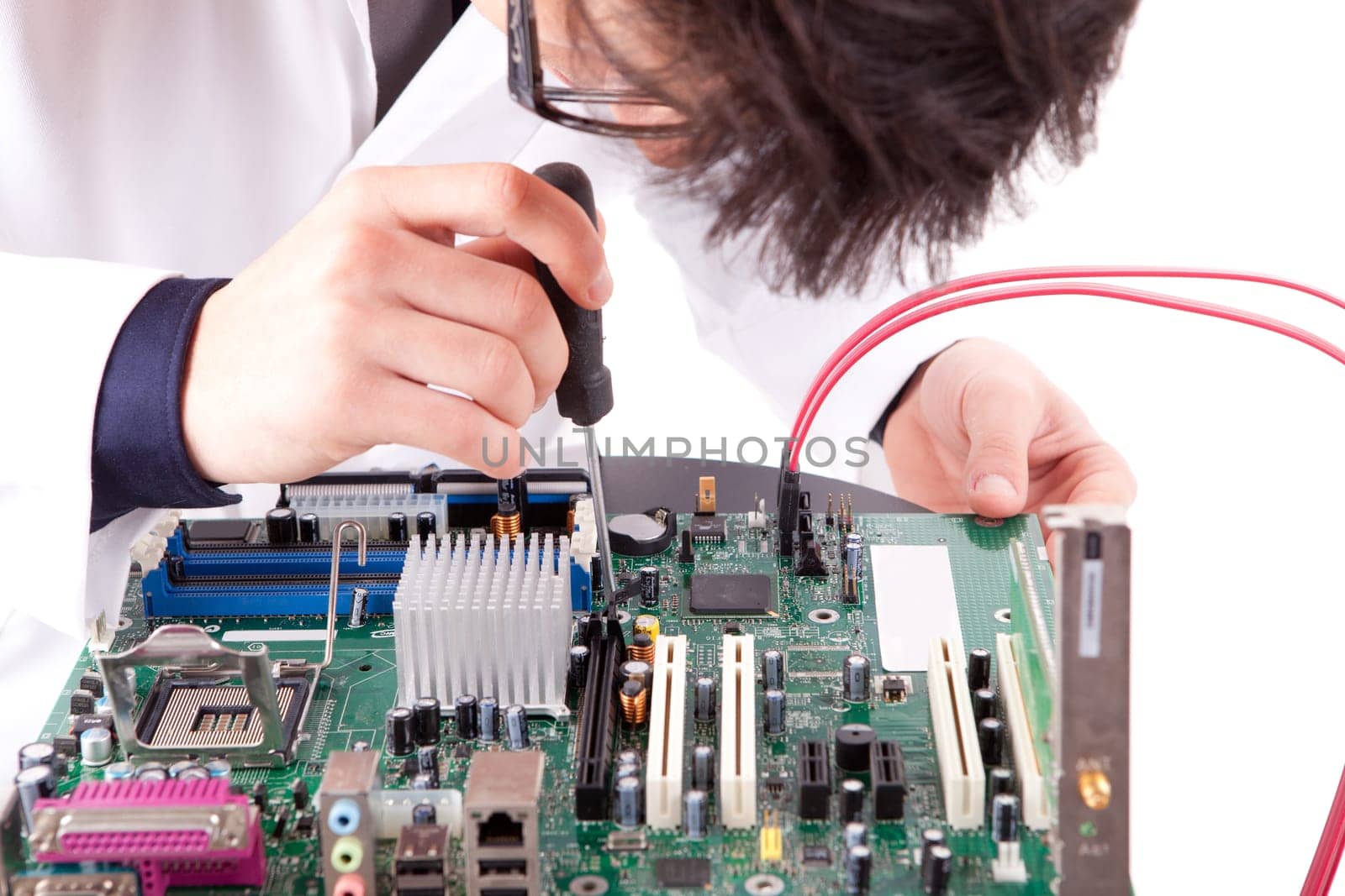 Computer engineer working on a old motherboard