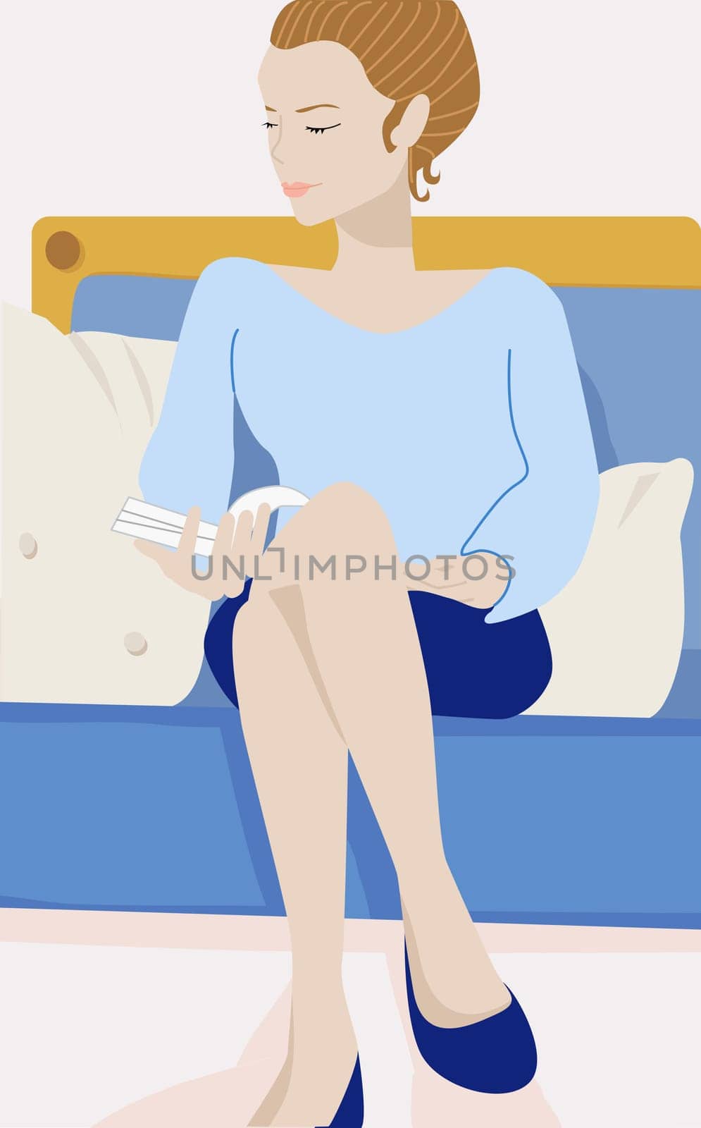 Young woman sitting on a couch and holding a book