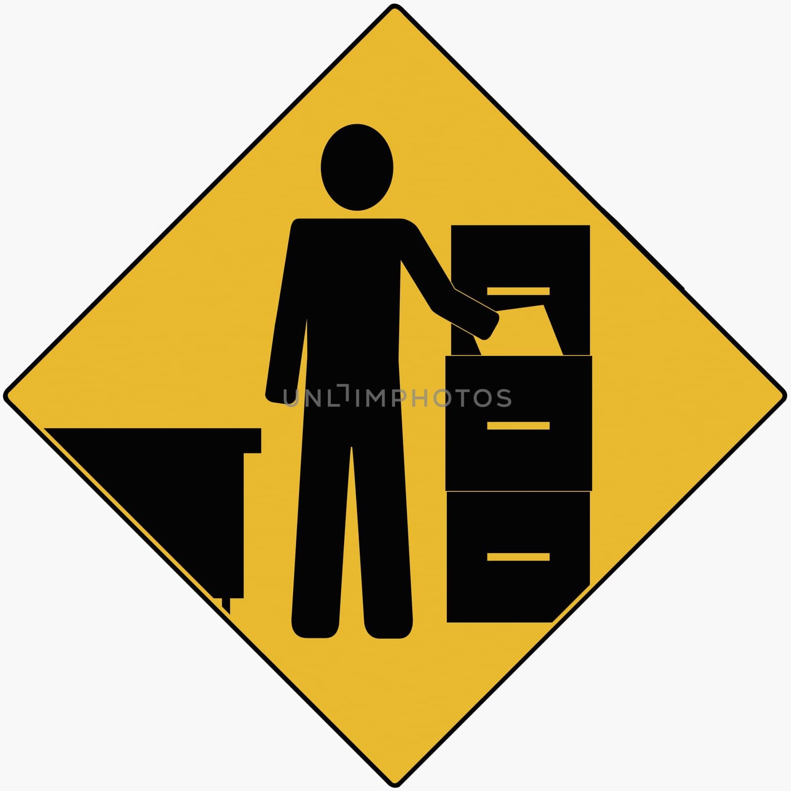Businessman standing near a file cabinet and holding a file