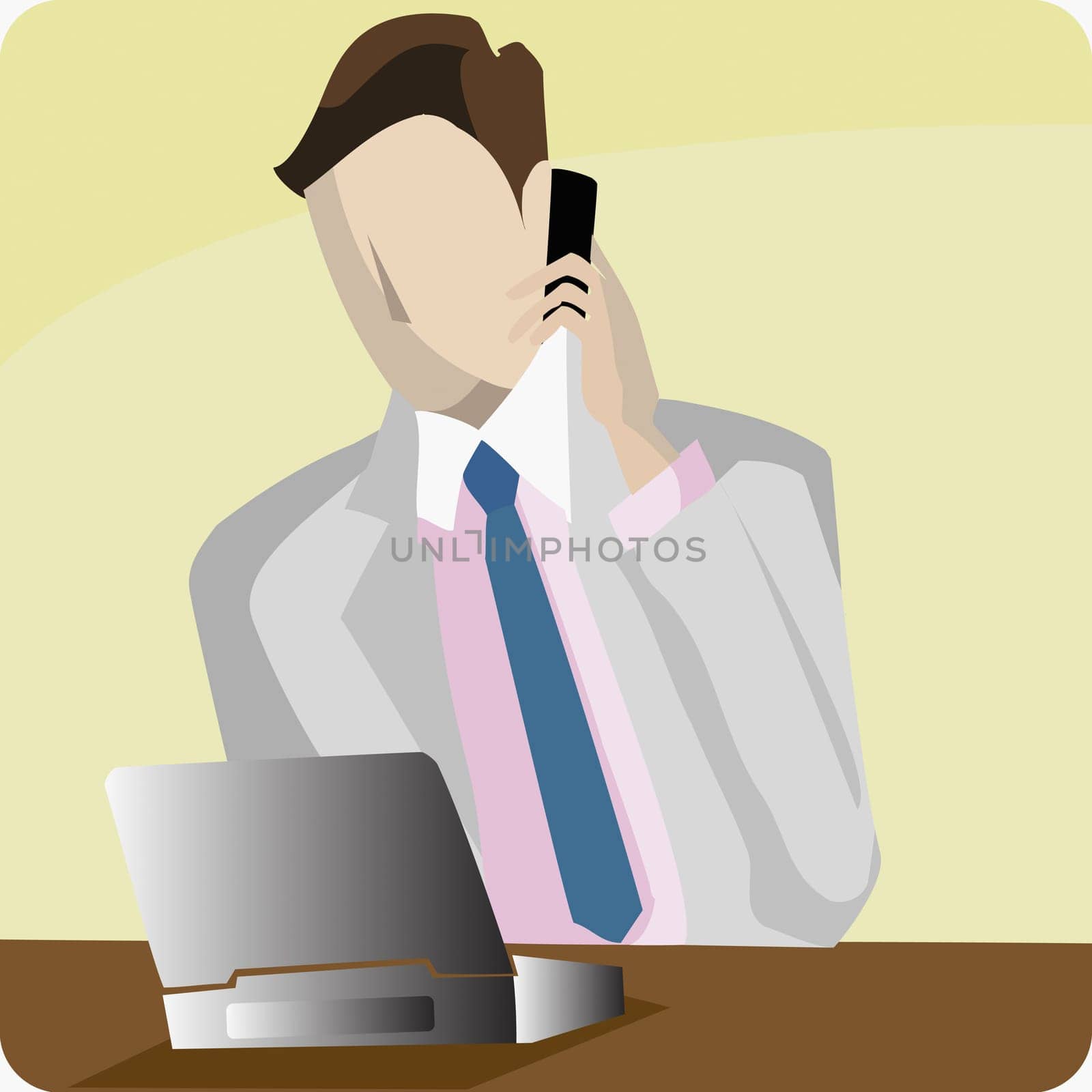 Businessman using a laptop and talking on a mobile phone