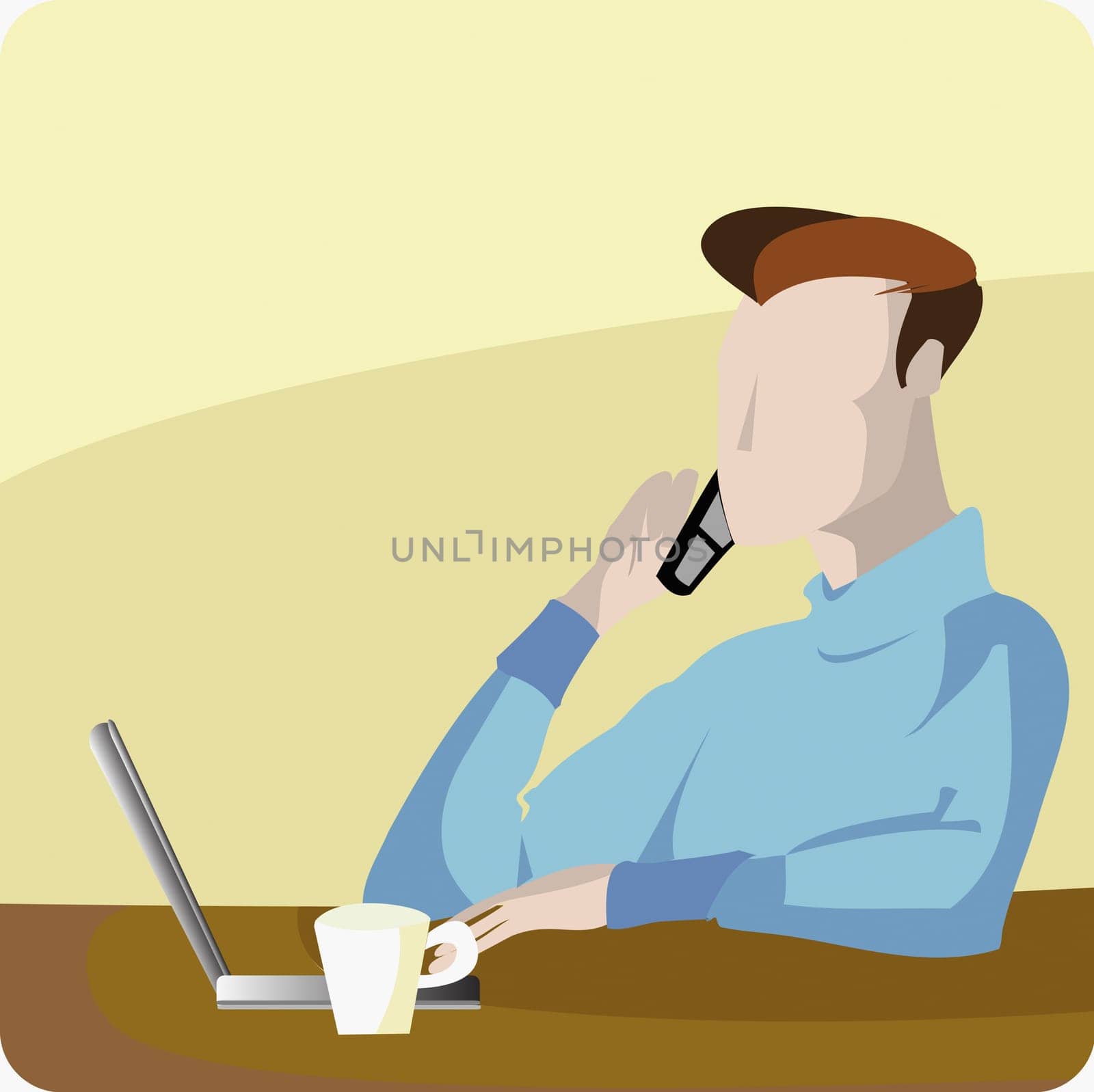 Young man using a laptop and talking on a mobile phone