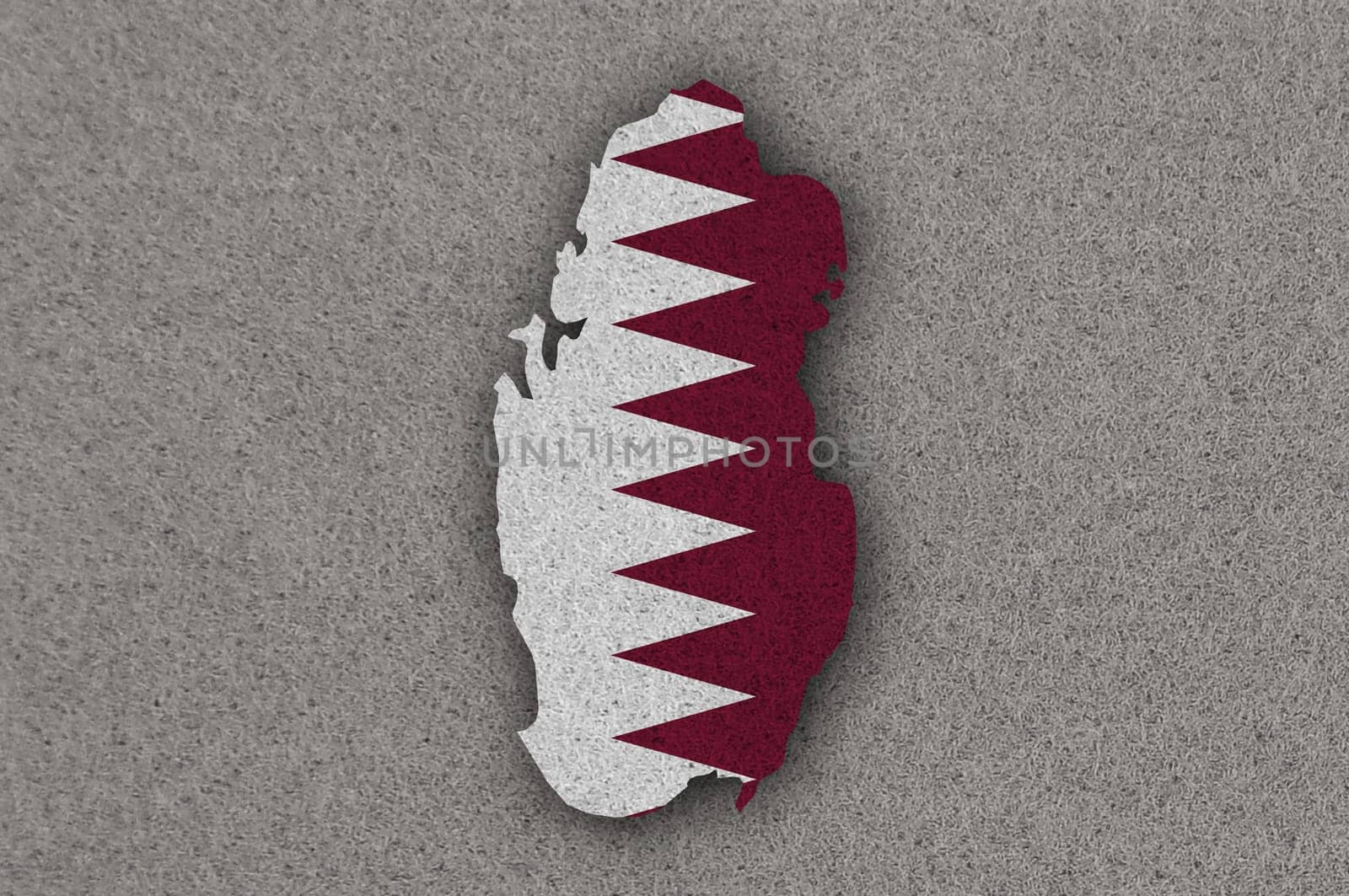 Map and flag of Qatar on felt