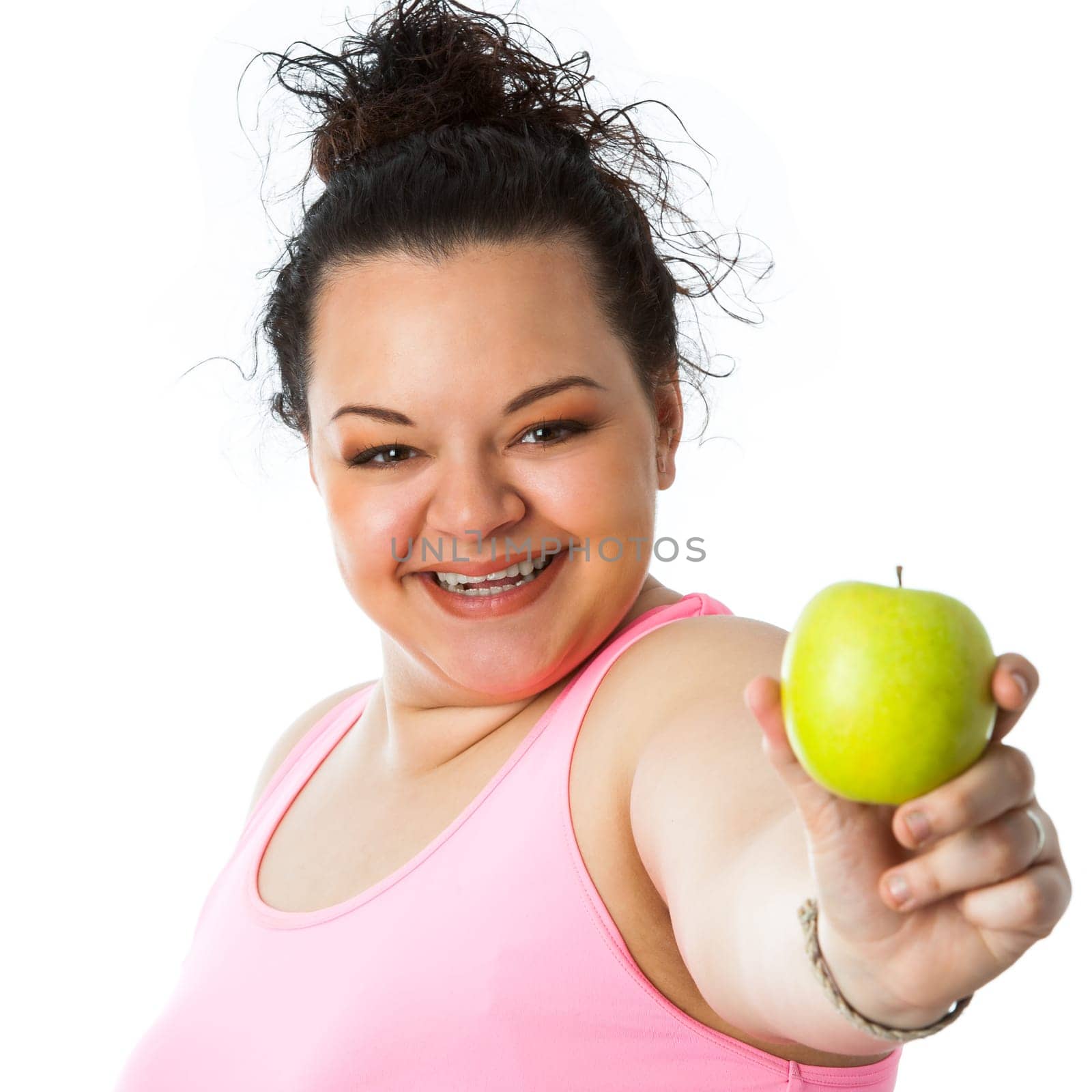 Close up portrait of overweight teen girl holding green apple.isolated on white background.