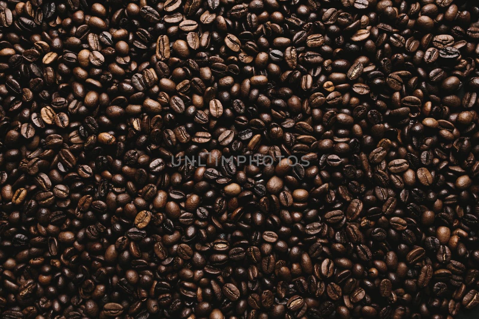 Background with array of dry coffee beans. High quality photo