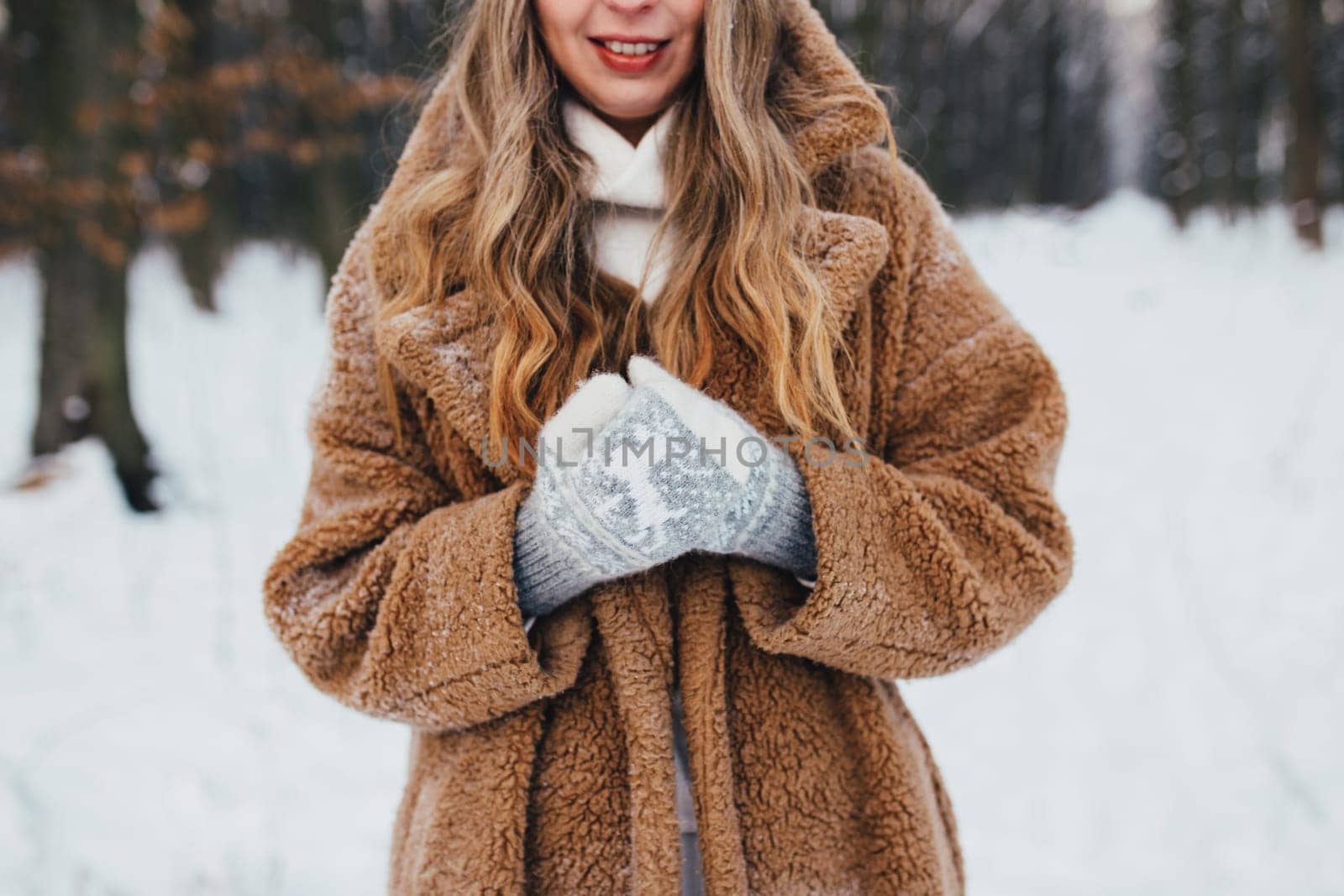 Young woman in fur coat, gloves and scarf in snowy forest. High quality photo