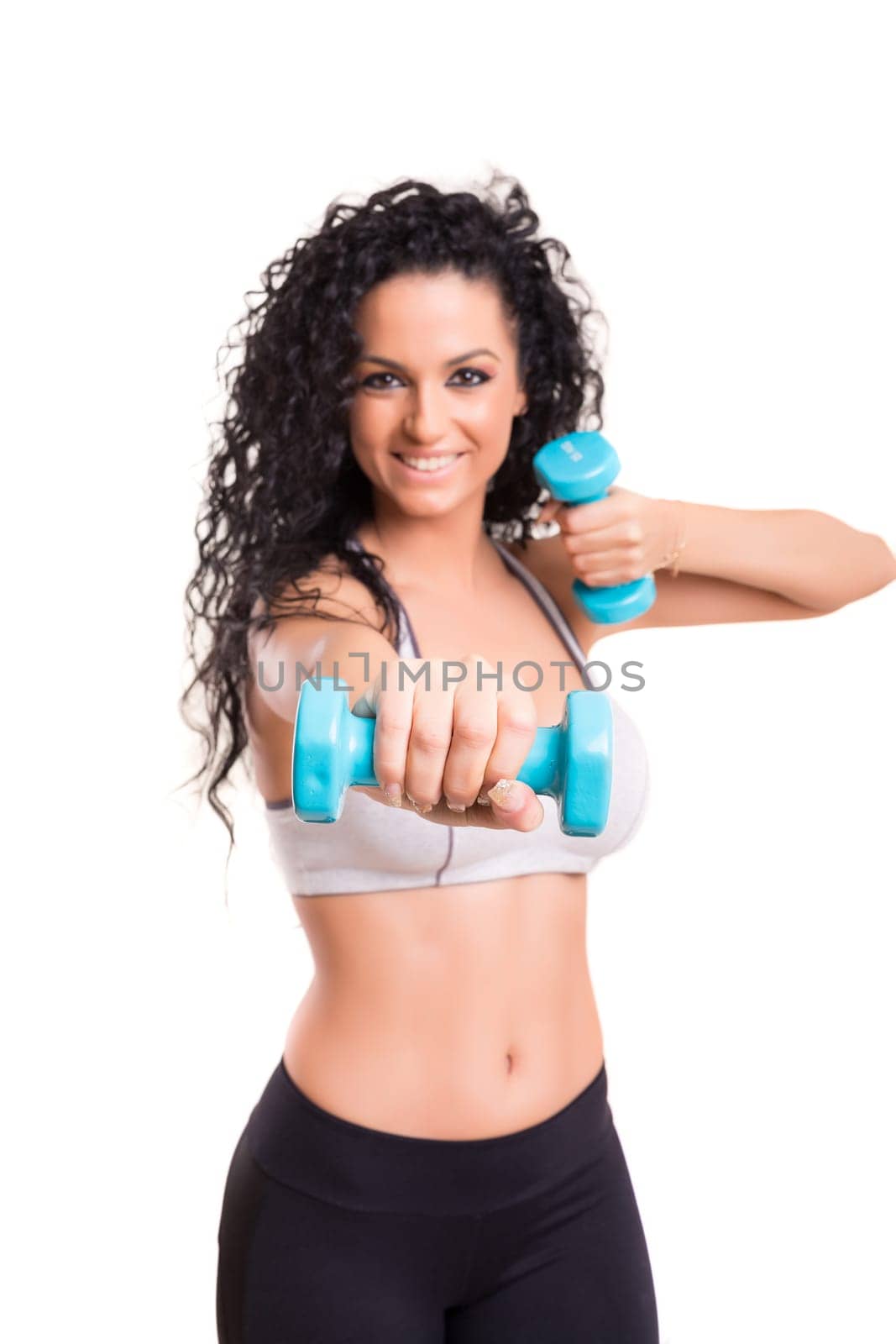 A beautiful young woman exercising - fitness concept