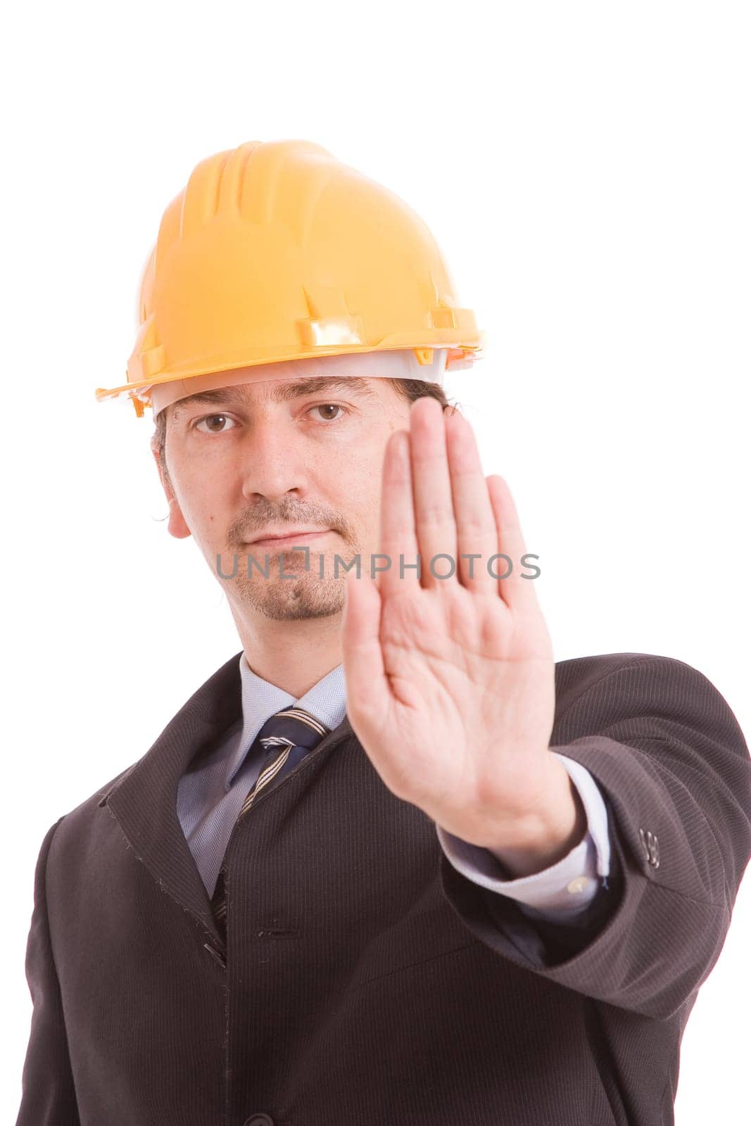 Engineer with yellow hat making stop sign