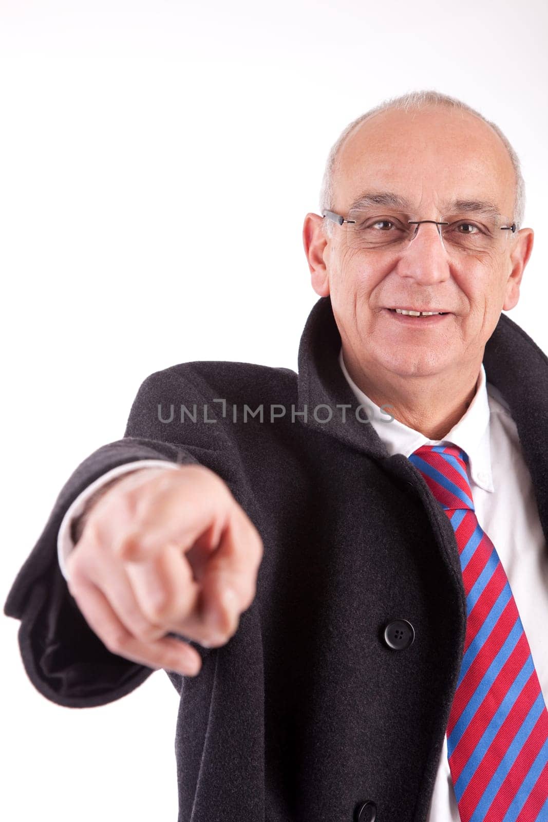 Mature business man pointing forward, isolated over white