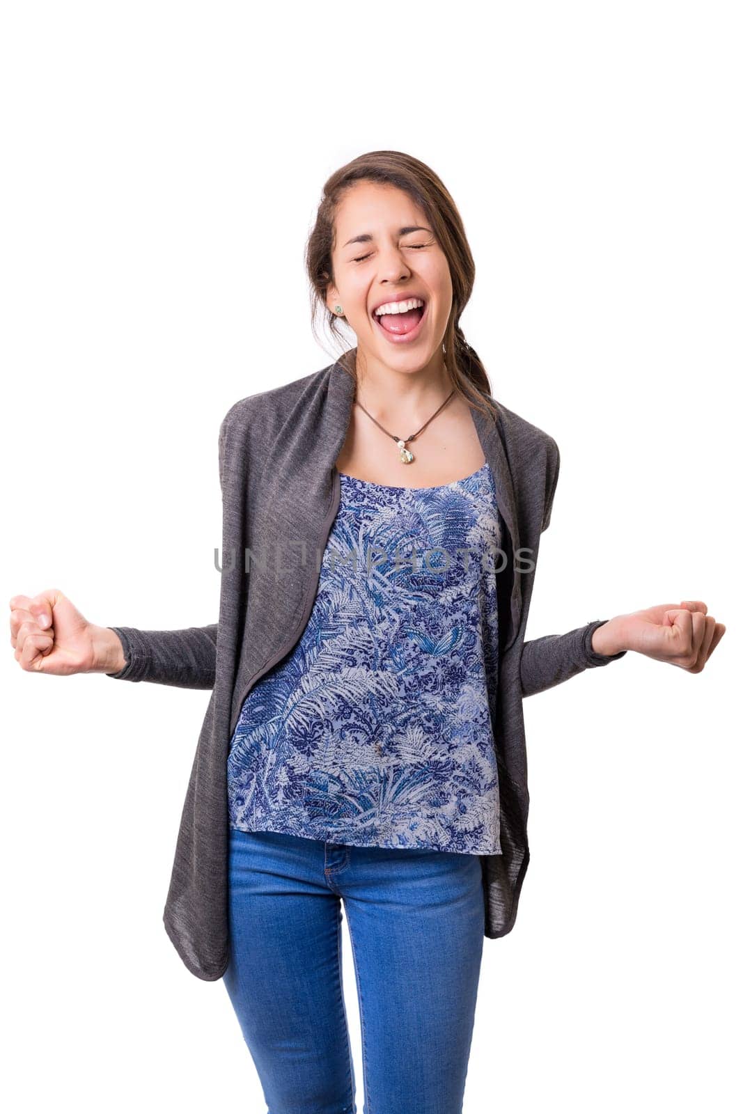 Studio shot: Happy woman with raised arms