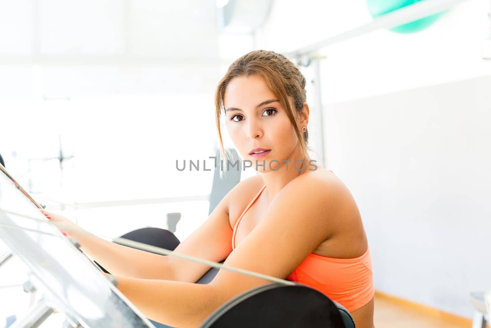 Young woman getting into shape with one more training session
