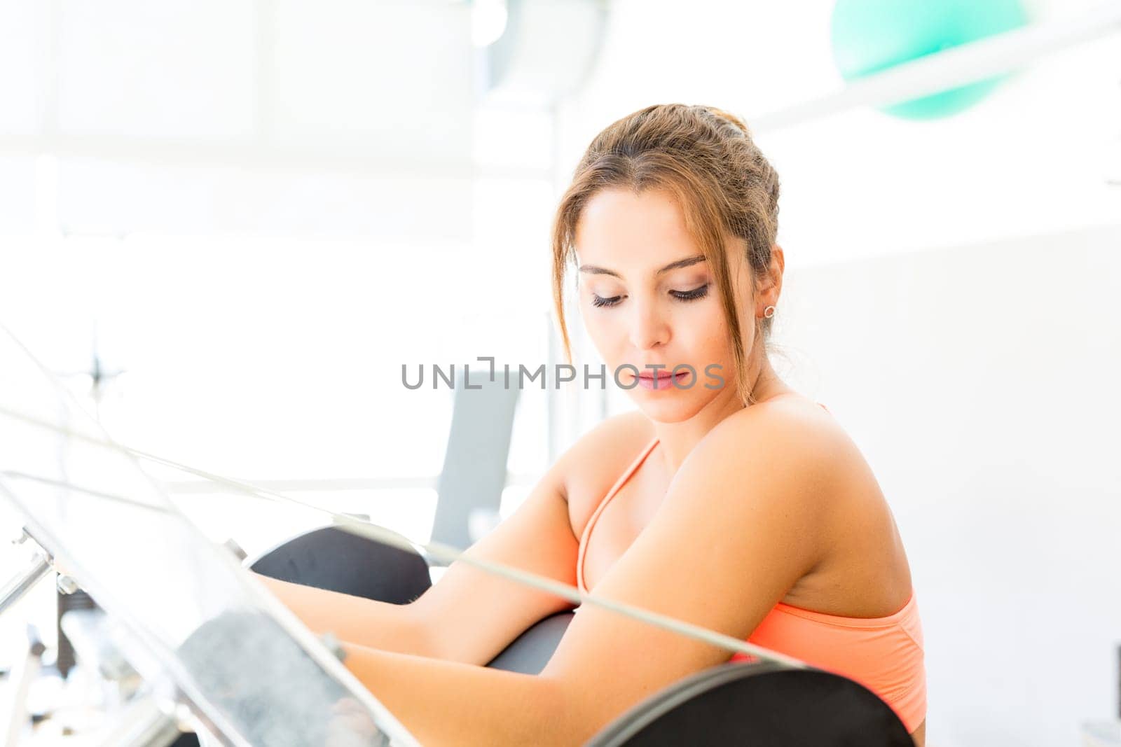 Young woman getting into shape with one more training session