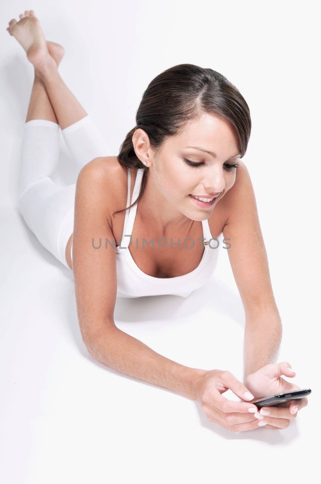 Woman text messaging on a mobile phone