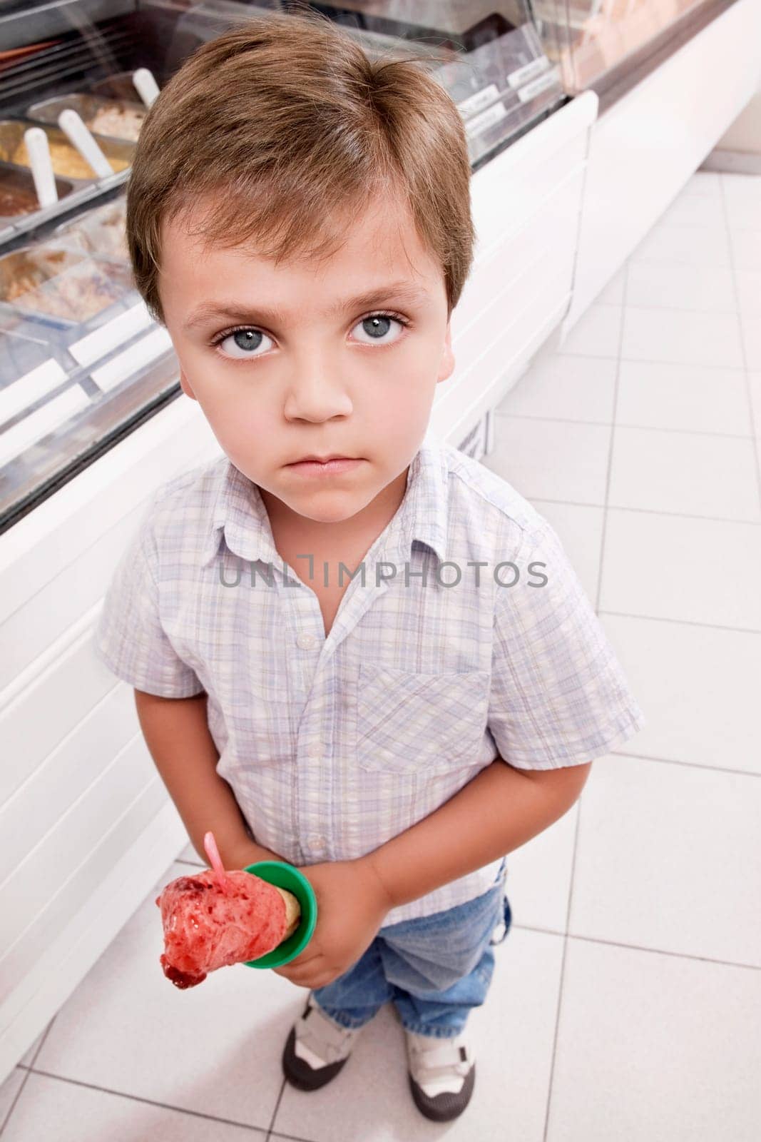 Portrait of a boy holding an ice cream