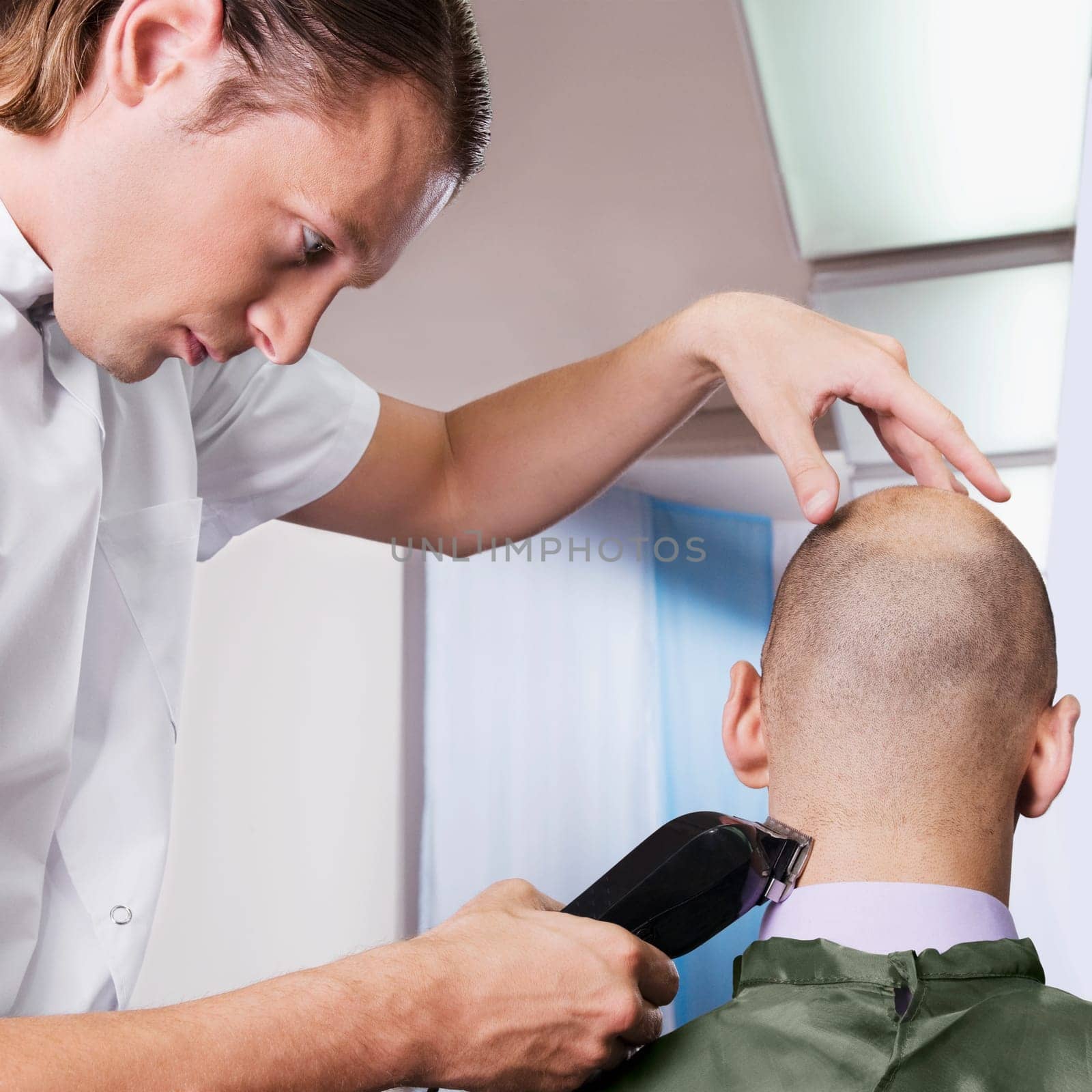 Man receiving a haircut in a salon