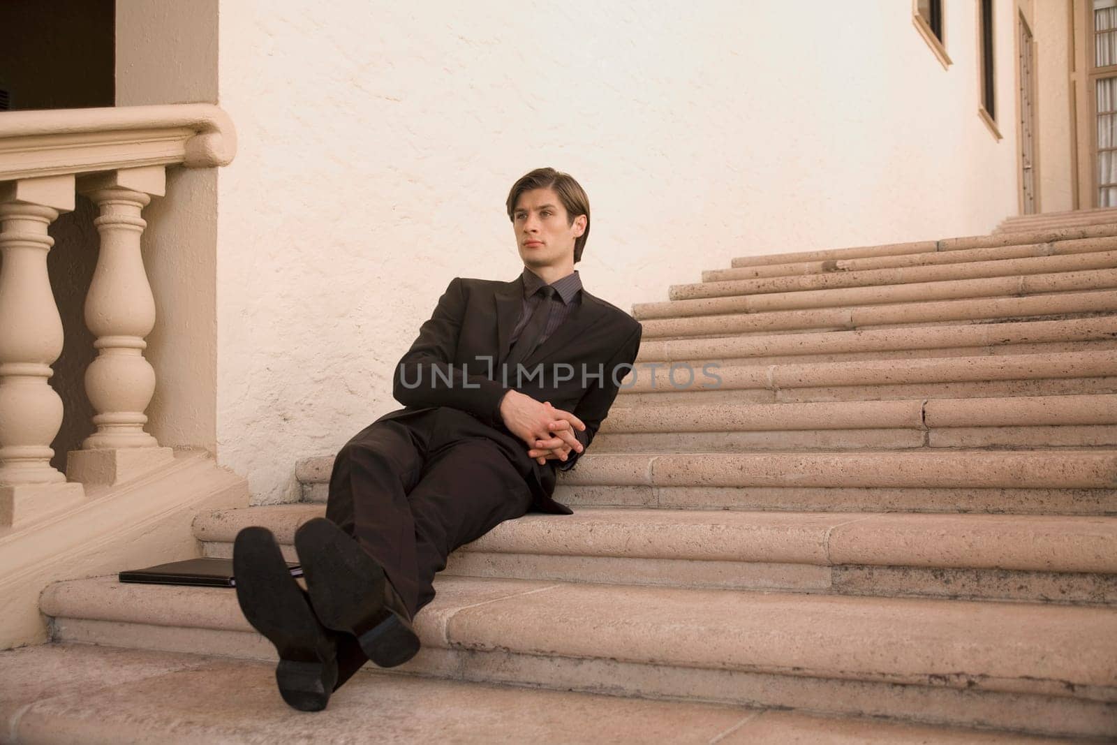 Businessman sitting on a staircase, Biltmore Hotel, Coral Gables, Florida, USA